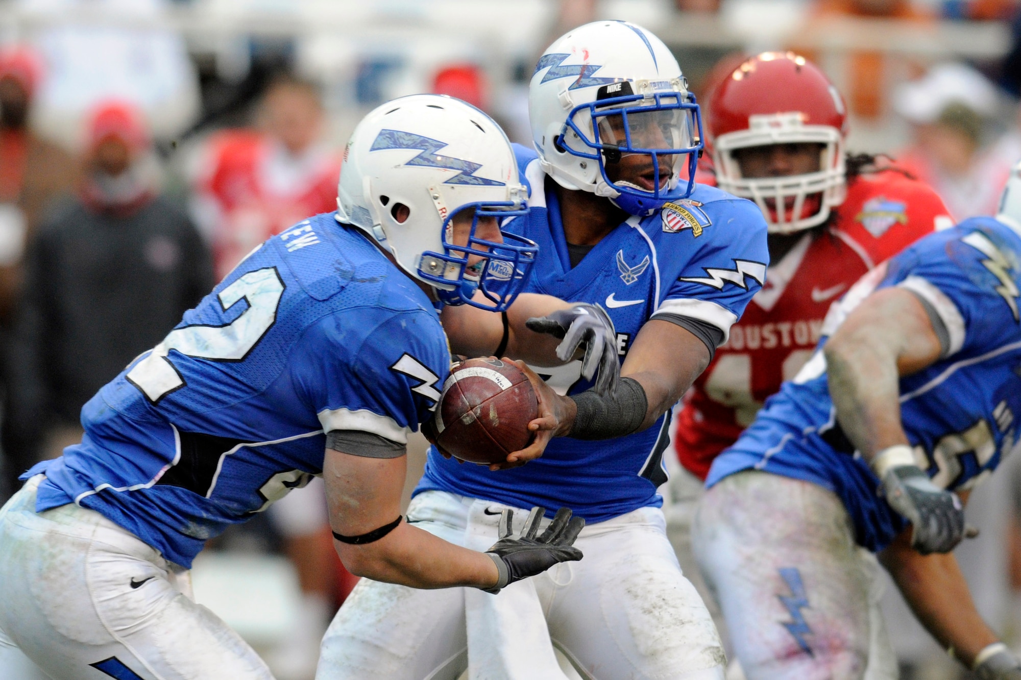 Falcons quarterback Tim Jefferson hands the ball to fullback Jared Tew during the 2009 Bell Helicopter Armed Forces Bowl. Air Force defeated the University of Houston 47-20 on Dec. 31. The Falcons will launch back into action for the 2010 season Sept. 4 against Northwestern State. (U.S. Air Force photo/ Bill Evans)