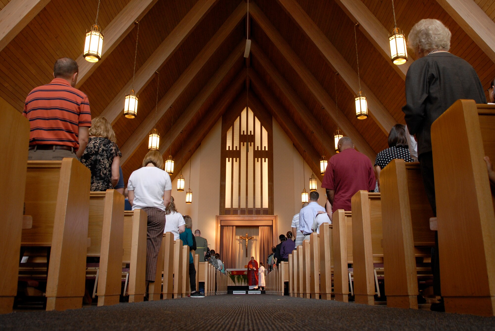 VANDENBERG AIR FORCE BASE, Calif. -- Air Force Reserve Chaplain (Lt. Col.) Thomas Kelly, the 30th Space Wing civilian Catholic priest, blesses the palms during the Palm Sunday Mass in the base chapel Sunday, March 28, 2010.  Chaplain Kelly performs his reserve duties at the 61st Air Base Wing, Los Angeles Air Force Base.  (U.S. Air Force photo/Senior Airman Andrew Satran) 

 

 

 