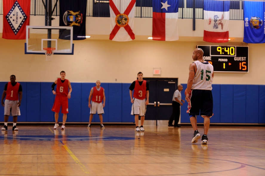 MOODY AIR FORCE BASE, Ga. -- Master Sgt. Thomas Clemens, 23rd Maintenance Operations Squadron scheduler, looks to the bench while bringing the ball up court during the championship game here March 26. This was a close game between the 23rd Medical Group and the 23rd MOS. The 23rd Medical Group came out on top with a second quarter comeback late in the game with a final score of 46-40. (U.S. Air Force photo by Airman 1st Class Joshua Green/RELEASED)