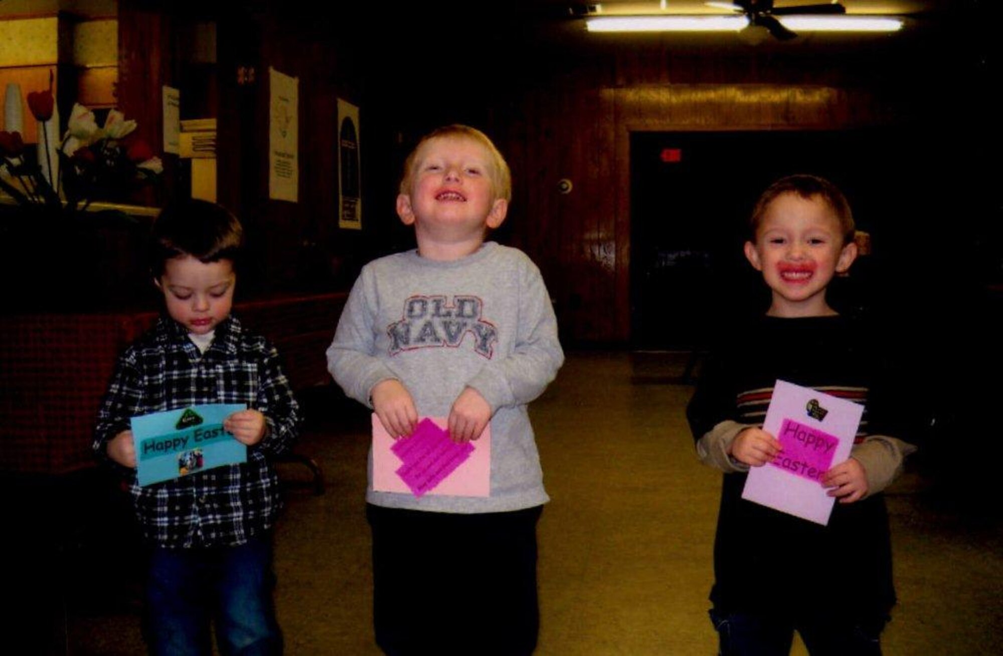 (From left) Alex Morton, 3, son of Tech. Sgt. Crystal Morton, 19th Medical Group, Jeffrey Vanya, 3, and Samuel Wheeler, 4, display their Easter cards March 14. St. John’s Lutheran Sunday School classes and their families met during a Families Relying on God night to make Easter cards for deployed Airmen. (Courtesy photo)