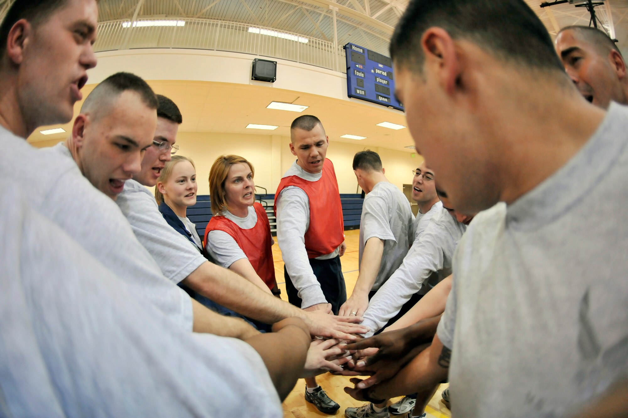 BUCKLEY AIR FORCE BASE, Colo. -- Buckley Airman Leadership School Class 10-D comes in for their final huddle March 22. ALS trains today's Airmen to become tomorrow's leaders. (U.S. Air Force photo by Senior Airman Kathrine McDowell)