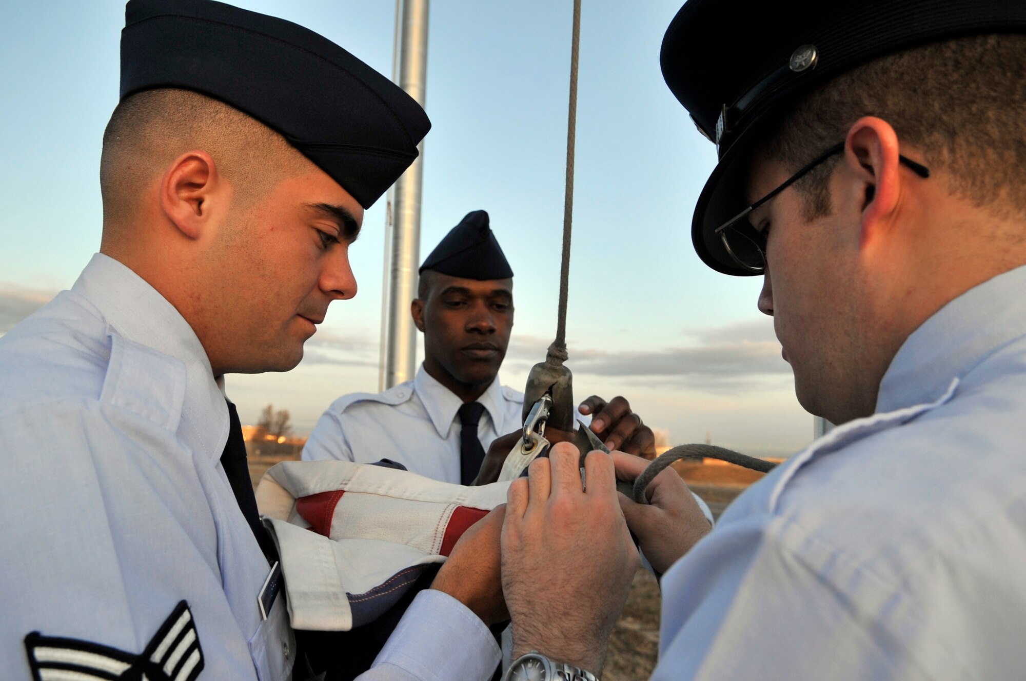 BUCKLEY AIR FORCE BASE, Colo. -- Senior Airmen Pete Murray, Darnell Walcott and Jeff Davey take down the colors at Buckley Airman Leadership School, March 22. ALS trains today's Airmen to become tomorrow's leaders. (U.S. Air Force photo by Senior Airman Kathrine McDowell)