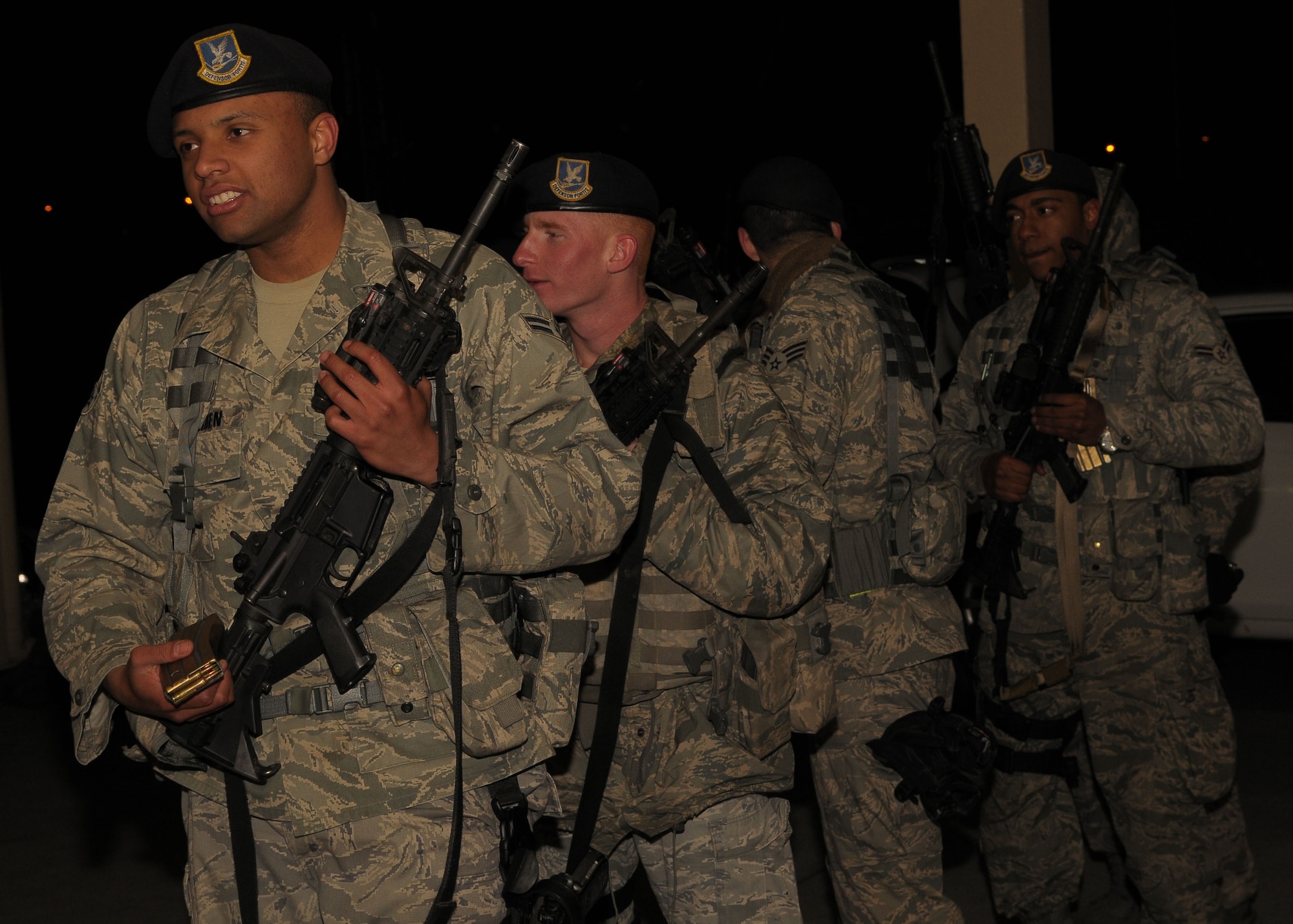YOKOTA AIR BASE, Japan -- Airmen from the 374th Security Forces Squadron prepare to turn in their weapons March 29 during an Operational Readiness Exercise here.  (U.S. Air Force photo/ Airman 1st Class Sean Martin)