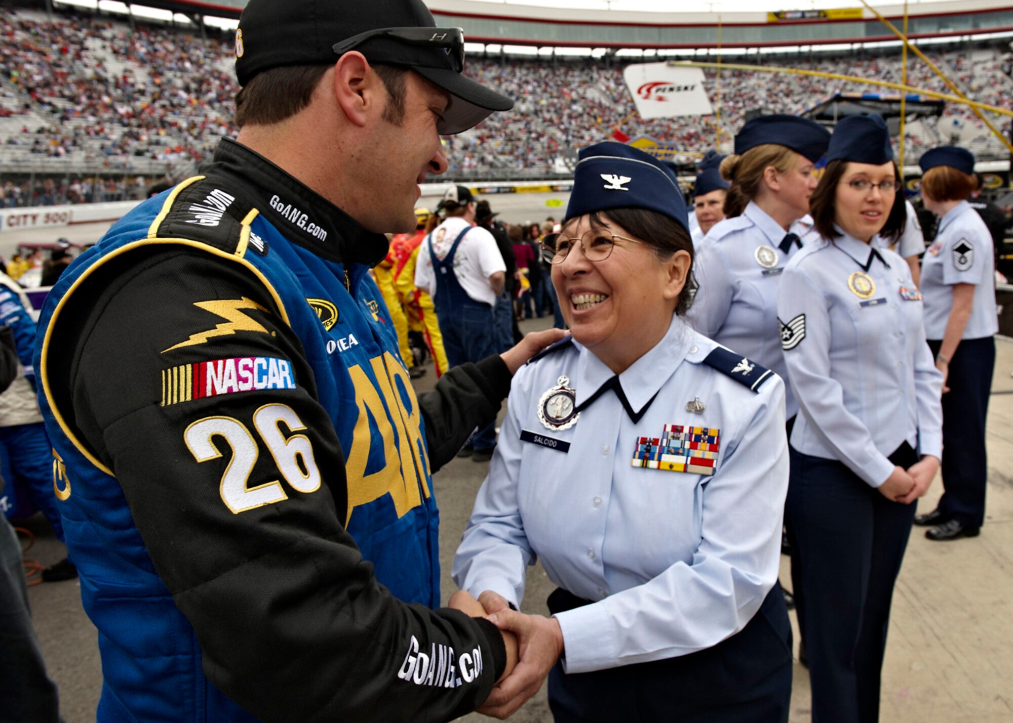 NASCAR driver David Stremme meets Air Force Col. Mary Salcido, director of Air Guard Recruiting and Retention, at Bristol, Tenn., during a Sprint Cup Series Race March 21. The Air National Guard's recruiters continue to reach lifetime achievements in accessions, with precision recruiting in technical, medical and officer careers, using new marketing strategies and technology. (U.S. Air Force photo by Senior Master Sgt. Rob Trubia) (Released)