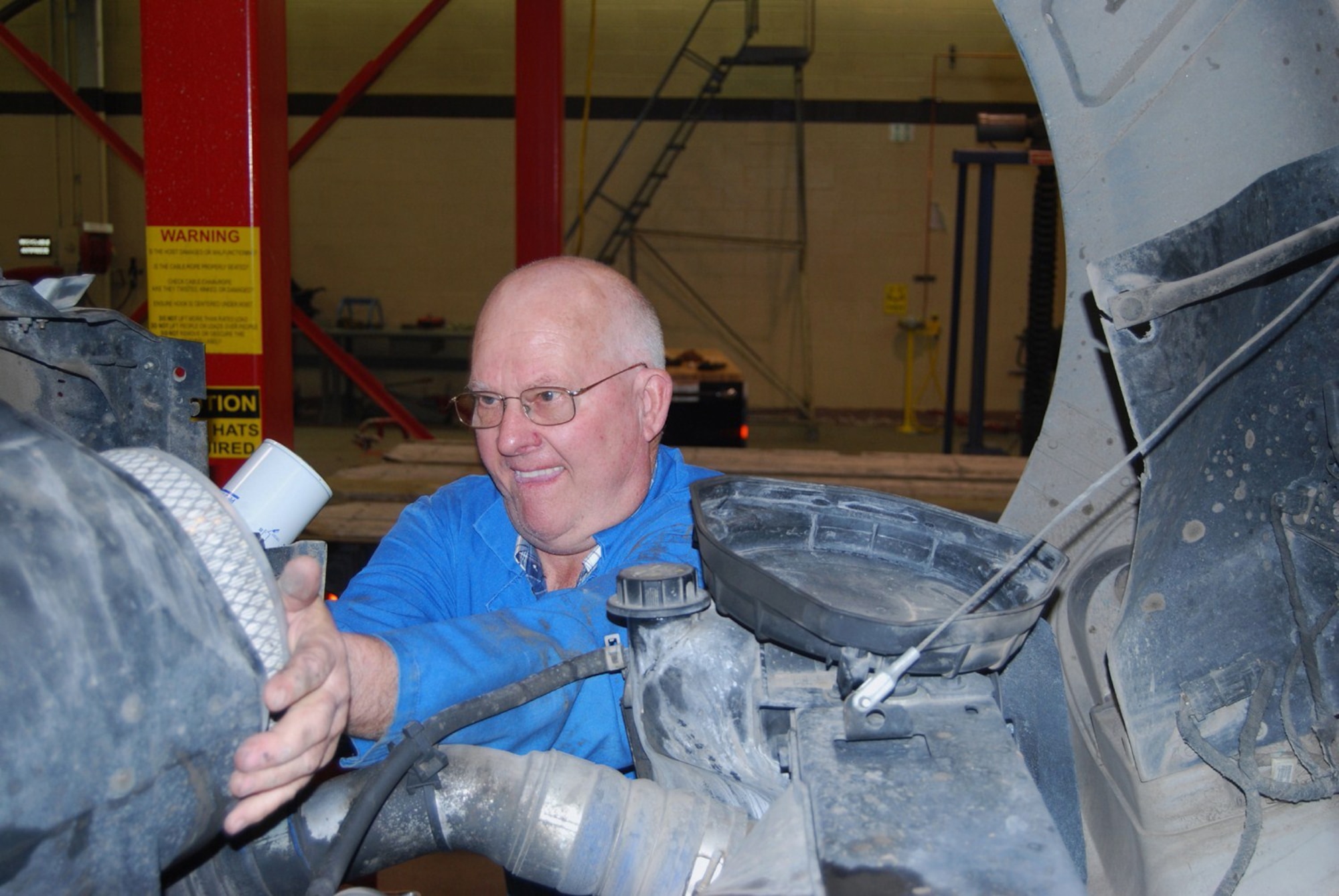 Allyn Hill, 341st Logistics Readiness Squadron mechanic, checks the engine of a missile maintenance van March 17. When he retires May 1, he will have served the United States military for more than 40 years. (U.S. Air Force photo/Airman 1st Class Kristina Overton)