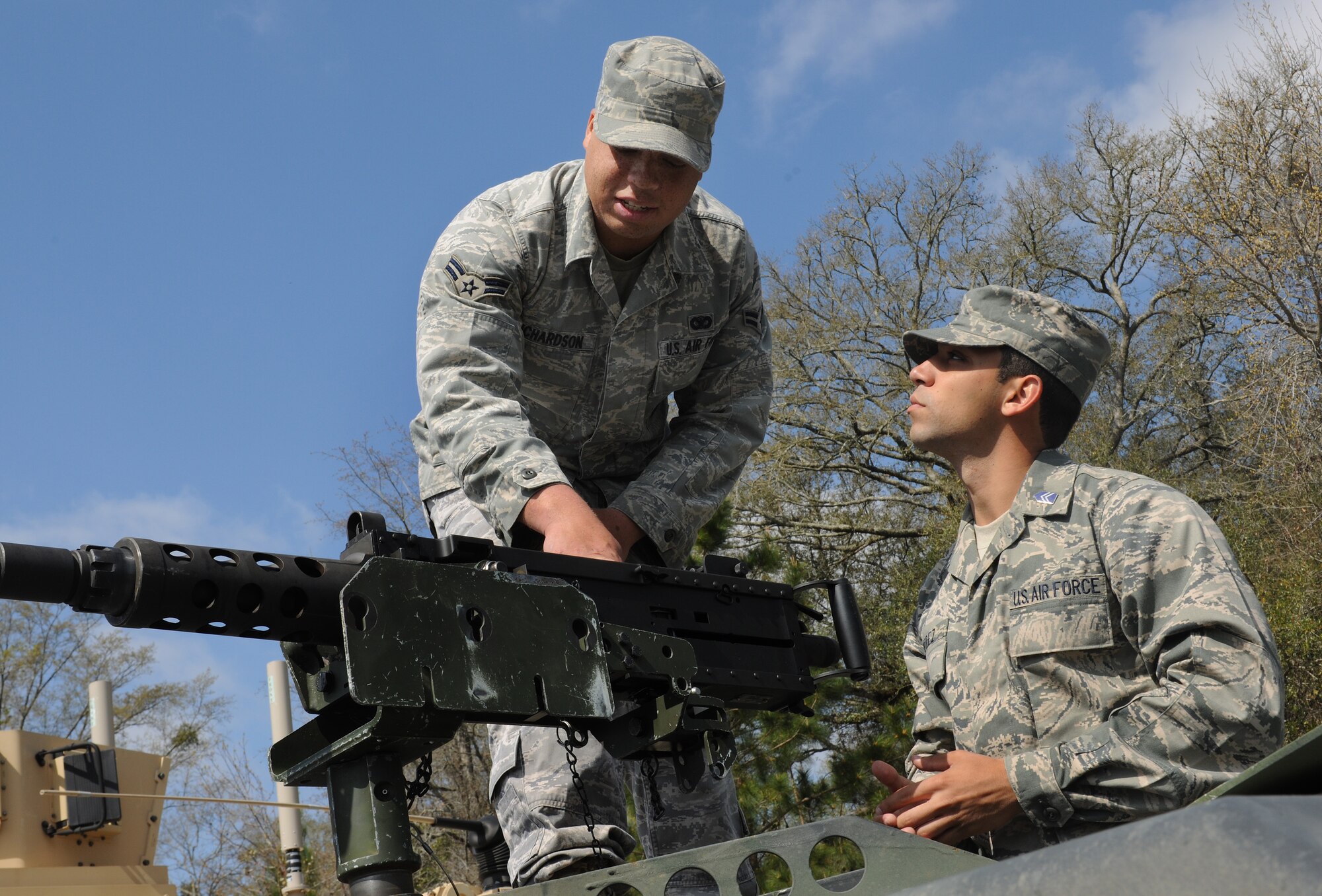 MOODY AIR FORCE BASE, Ga. -- Airman 1st Class Kevin Richardson, 823rd Security Forces Squadron fire team member, shows off the M-2 heavy machine gun to Cadet 3rd Class Rolando Perez from the University of Puerto Rico Air Force ROTC Detachment 755 here March 23. The cadets were given the opportunity to meet security forces members and handle weapons from the 820th Security Forces Group’s arsenal. (U.S. Air Force photo by Airman 1st Class Benjamin Wiseman/RELEASED)