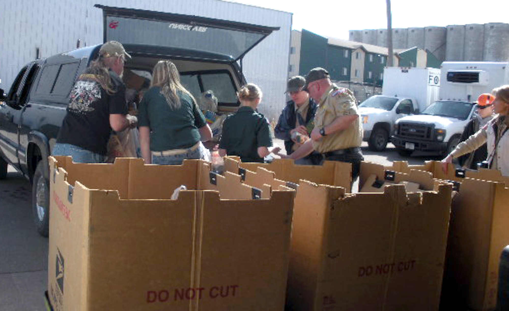 Members of Boy Scout Troop 43 and volunteers unload and sort donations from their 16th annual Scouting for Food food drive March 20. Donations were given to the Great Falls Community Food Bank.(courtesy photo)
