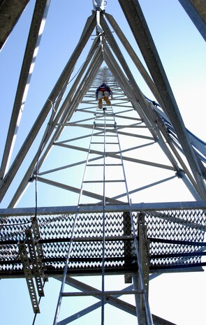 U.S. Air Force Senior Airman Riley Cusson begins his climb up the radio tower on Joint Base Charleston, S.C., March 23, 2010. Airman Cusson scaled the 110-foot tower to maintain his certification while checking the line-of-sight to Naval Weapons Station Charleston. Airman Cusson is a radio frequency transmission systems specialist with the 628th Communications Squadron. (U.S. Air Force photo/Airman 1st Class Lauren Main)