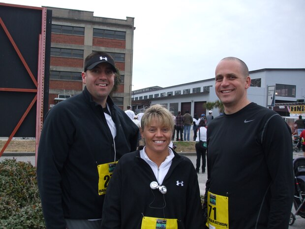 From left, Master Sgt. Steven Hart, 628th Communications Squadron first sergeant, Master Sgt. Kristina Mullins, 15th Airlift Squadron first sergeant and Master Sgt. Christopher Boyer, 628th Civil Engineer Squadron first sergeant, join for the Riverfront Festival half-marathon Jan. 16, 2010, in Charleston, S.C. The senior NCOs are members of the first sergeants running team. The team recently participated in the Cooper River Bridge Run annual 10K running event, which begins in Mount Pleasant and ends in downtown Charleston. (Courtesy photo)