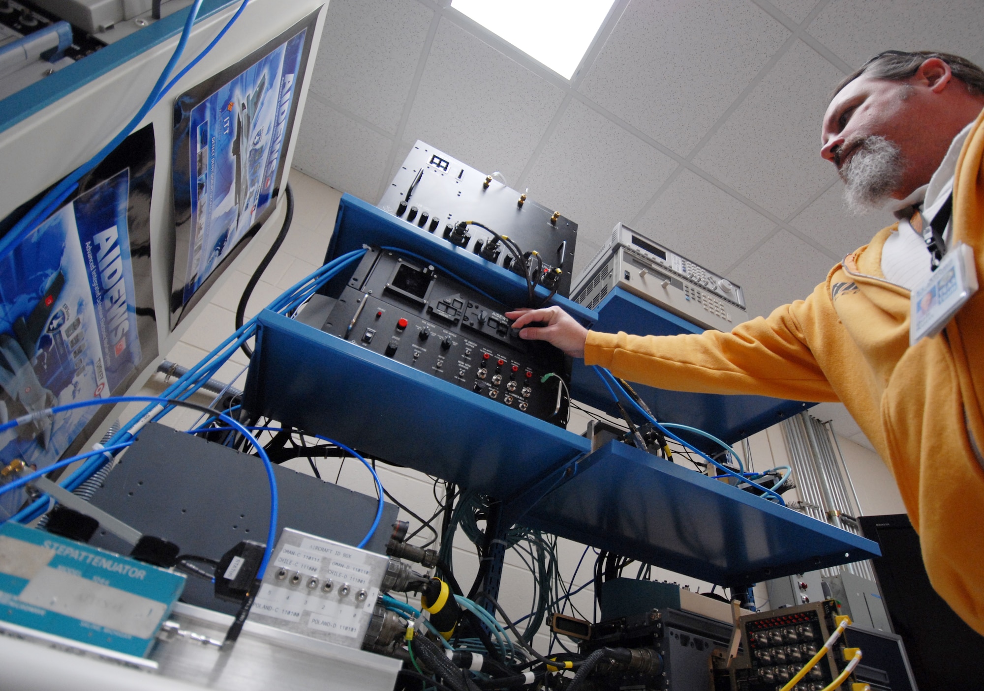 Bob Korn, 68th Electronic Warfare Squadron contractor, prepares the Advanced Integrated Defense Electronic Warfare System test lab for a test run.  Members of the Advanced Systems Flight of the 68th EWS, work closely with their foreign customers to facilitate future requirements so their mission data can be tailored to the ever-changing threat environment and define customer's necessities to build future products. (U.S. Air Force photo/Samuel King Jr.)