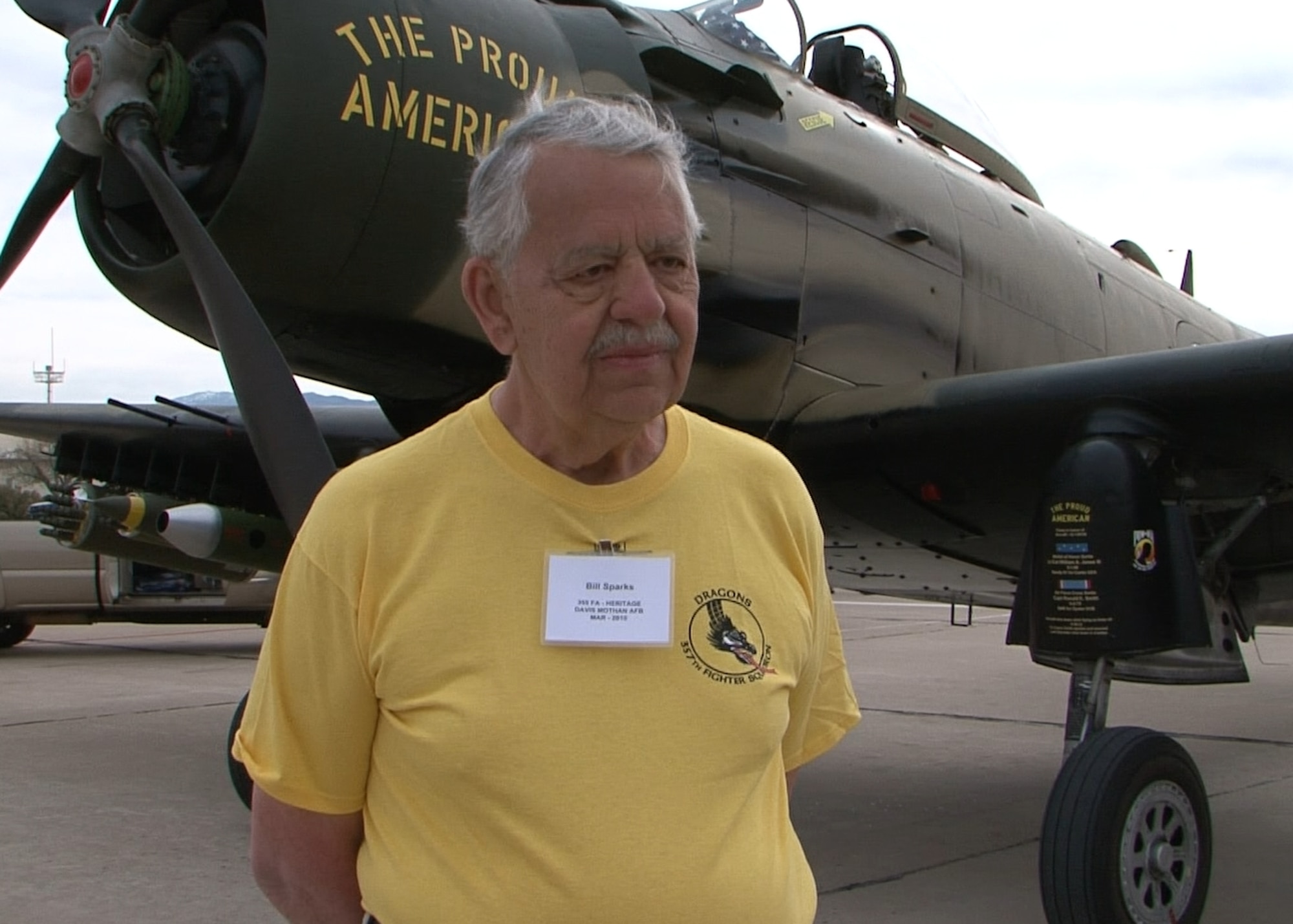 LANGLEY AIR FORCE BASE, Va. (ACCNS) -- Retired Air Force Lt. Col. Bill Sparks stands next to an A-1, recounting his story of being shot down over North Vietnam. Colonel Sparks shares the harrowing account of piloting his F-105 as far south as possible before having to eject and later being rescued from the jungle.