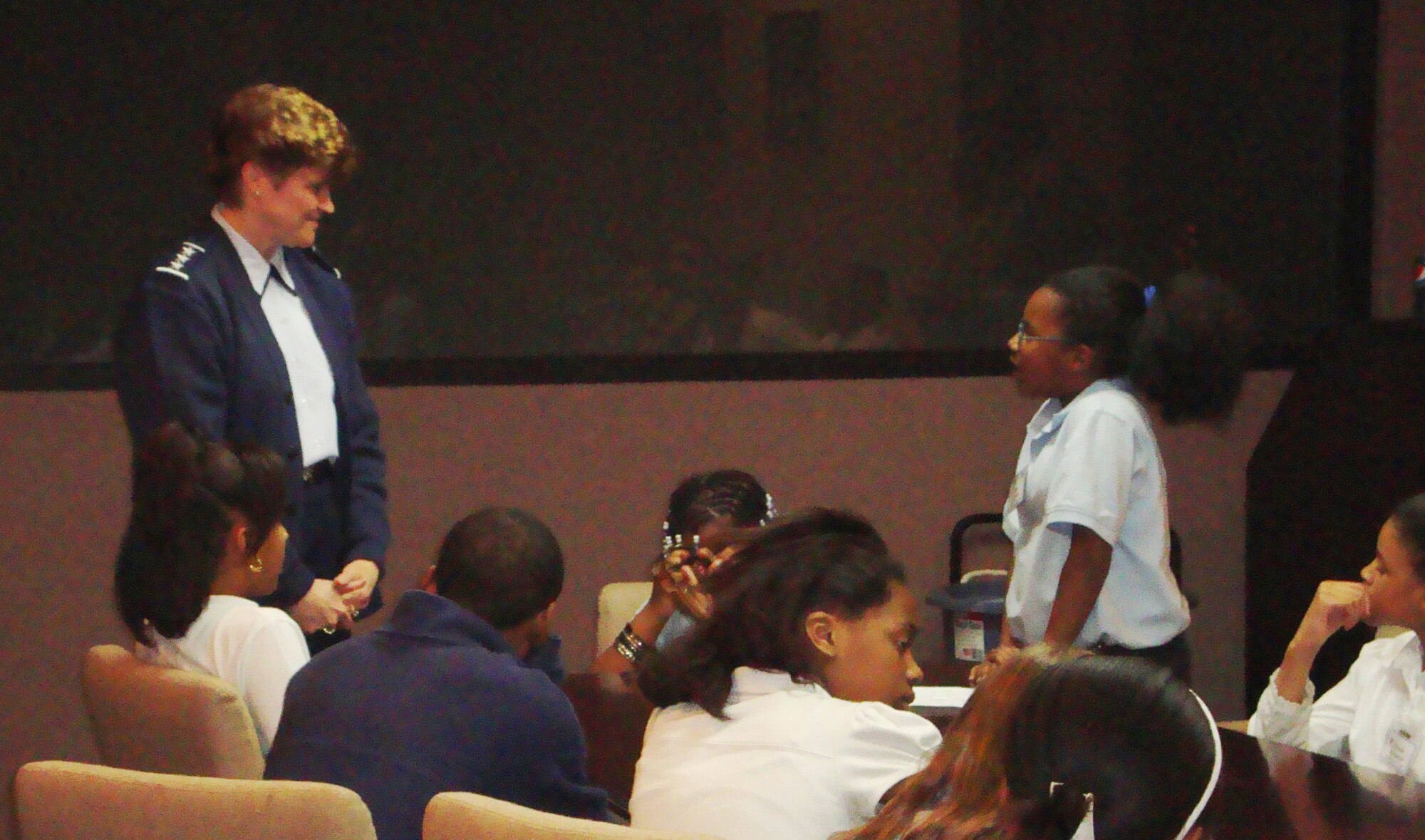 Lt. Gen. Janet Wolfenbarger, Air Force Materiel Command vice commander, answers a question asked by a Meadowdale PreK-8 School student during a visit to AFMC headquarters March 24. About 40 students participated in a job shadowing event organized by a Wright-Patterson AFB group called Airmen Acting. The group's mentoring program pairs volunteers from the base with students in an effort to provide guidance and help the students make responsible choices. (U.S. Air Force photo/Chandra Lloyd)