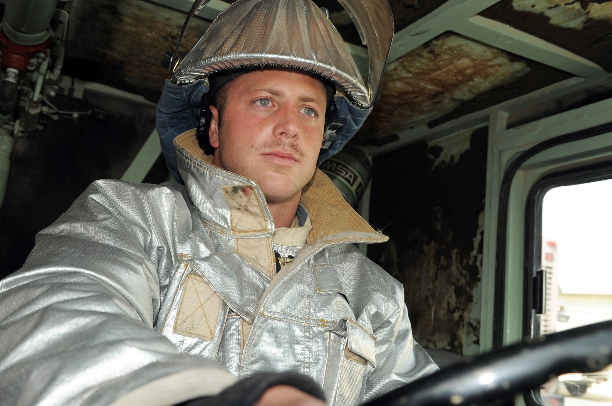 Airman 1st Class Kevin Collins, an Air Force firefighter deployed with the 380th Expeditionary Civil Engineer Squadron fire department, drives a fire truck during operations at a non-disclosed base in Southwest Asia on March 29, 2010. As an emergency responder, Airman Collins and his fellow firefighters are responsible for protecting thousands of deployed personnel and billions of dollars of Air Force assets from fire. He is deployed from the 9th Civil Engineer Squadron at Beale Air Force Base, Calif., and his hometown is Gilroy, Calif. (U.S. Air Force Photo/Master Sgt. Scott T. Sturkol/Released)