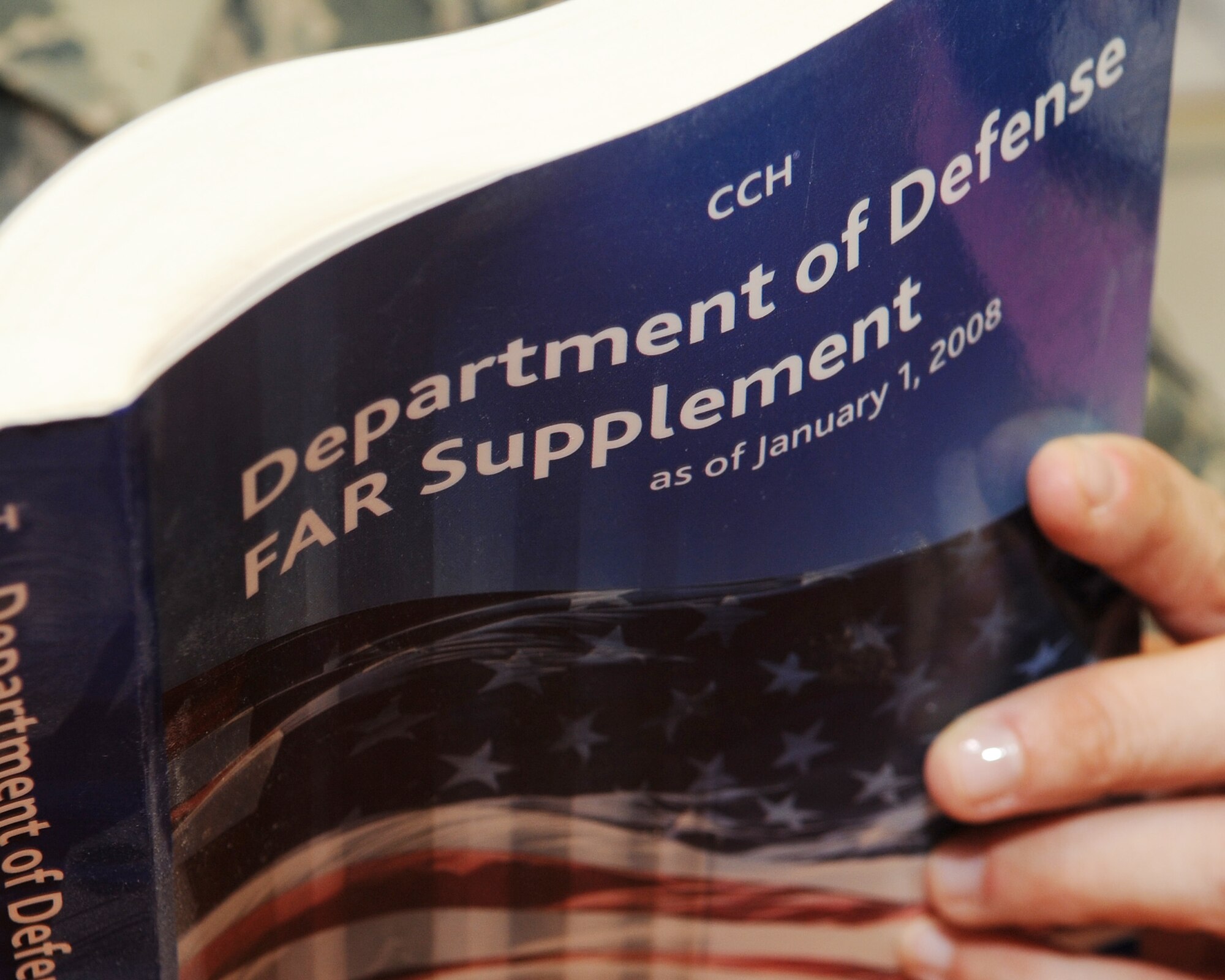 Tech. Sgt. Rebbecca Drydol-Brandon, Joint Contracting Command – Iraq contracting officer, verifies a regulation before soliciting a project on Kirkuk Regional Air Base, Iraq on March 24, 2010.  If the government cannot fulfill a specific requirement with its own manpower and resources, contracting officers solicit vendors from the local area to meet it.  Sergeant Drydol-Brandon is deployed from Vandenberg AFB, Calif.  (U.S. Air Force photo/Staff Sgt. Tabitha Kuykendall/Released)