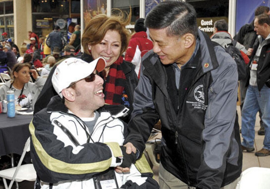 Veterans Affairs Secretary Eric K. Shinseki greets Alan Babin, an Army veteran and patient at the San Antonio VA Medical Center, during the 23rd National Disabled Veterans Winter Sports Clinic on March 29, 2009. Babin was wounded in Iraq while serving as a medic with the 82nd Airborne Division. He is pictured with his mother, Rosalinda Babin. Babin is back to participate in the 2010 clinic. Photo by Bob Peterson 
