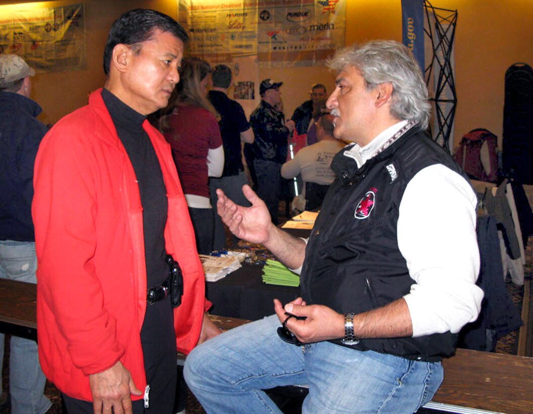 Veterans Affairs Secretary Eric K. Shinseki chats with Sandy Trombetta, founder and director of the National Disabled Veterans Winter Sports Clinic, before last night’s opening ceremonies in Snowmass Village, Colo., March 28, 2010.