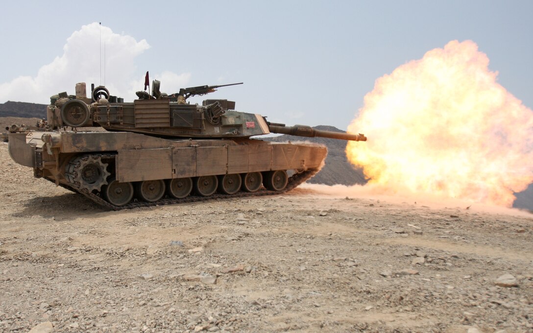 A M1A1 Abrams battle tank from Tank platoon Alpha Company, Battalion Landing Team 1st Battalion, 9th Marine Regiment, 24th Marine Expeditionary Unit, discharges a 120mm round towards a tank hull during a live-fire range in Djibouti, Africa March 30.  Marine tank crewmen engaged various targets alongside the French 13th Foreign Legion Demi-Brigade as part of a joint exercise.  The 24th MEU is currently serves as the theatre reserve force for Central Command during its seven month deployment aboard Nassau Amphibious Ready Group vessels.  (U.S. Marine Corps photo by Sgt. Alex C. Sauceda)