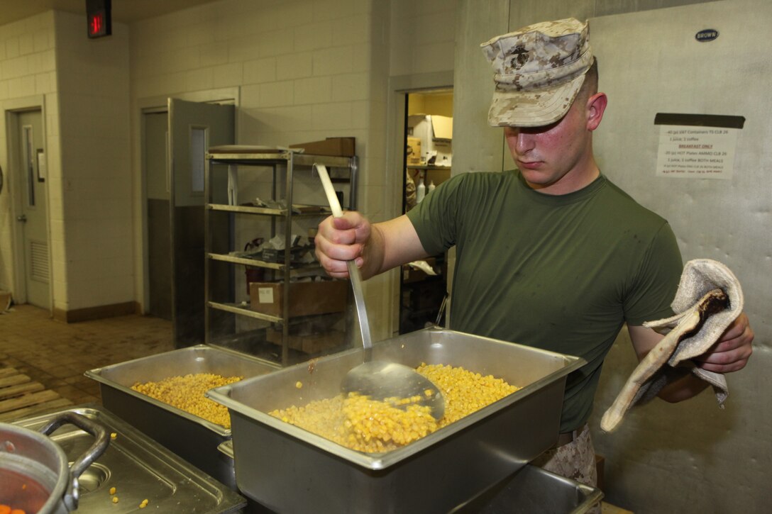 Lance Cpl. Patrick P. Corey, a food service specialist with 26th Marine Expeditionary Unit’s Combat Logistics Battalion 26, prepares corn for evening chow at a Fort Pickett mess hall during the MEU’s exercise aboard Fort Pickett, Va., March 30, 2010. The exercise is the first in a series of training evolutions for the MEU that will culminate in its deployment aboard the ships of the Kearsarge Amphibious Ready Group in the fall. (Official United States Marine Corps Photo by Lance Cpl. Santiago G. Colon Jr.) (Released)::r::::n::