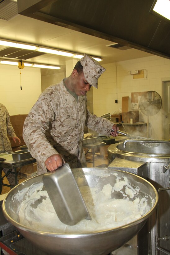 Lance Cpl. Lamond G. Shell, a food service specialist with 26th Marine Expeditionary Unit’s Combat Logistics Battalion 26, prepares mashed potatoes at a Fort Pickett mess hall during the MEU’s exercise aboard Fort Pickett, Va., March 30, 2010. The exercise is the first in a series of training evolutions for the MEU that will culminate in its deployment aboard the ships of the Kearsarge Amphibious Ready Group in the fall. (Official United States Marine Corps Photo by Lance Cpl. Santiago G. Colon Jr.) (Released)::r::::n::
