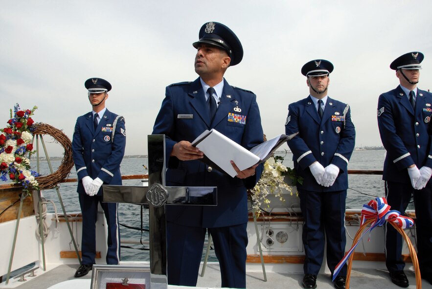 Chaplain 1st Lt. David Sarmiento gives a speech during a memorial service for T-33A pilots 1st Lts. Richard Theiler and Paul Smith. The fallen heroes crashed 55 years ago, but the wreckage was recently found in May 2009. This sparked the need to hold military honors for the crew members at Dockweiler State Beach and at sea, over 100 feet above the wreckage and three miles off the coast. (U.S. Air Force photo by Staff Sgt Paul Duquette)