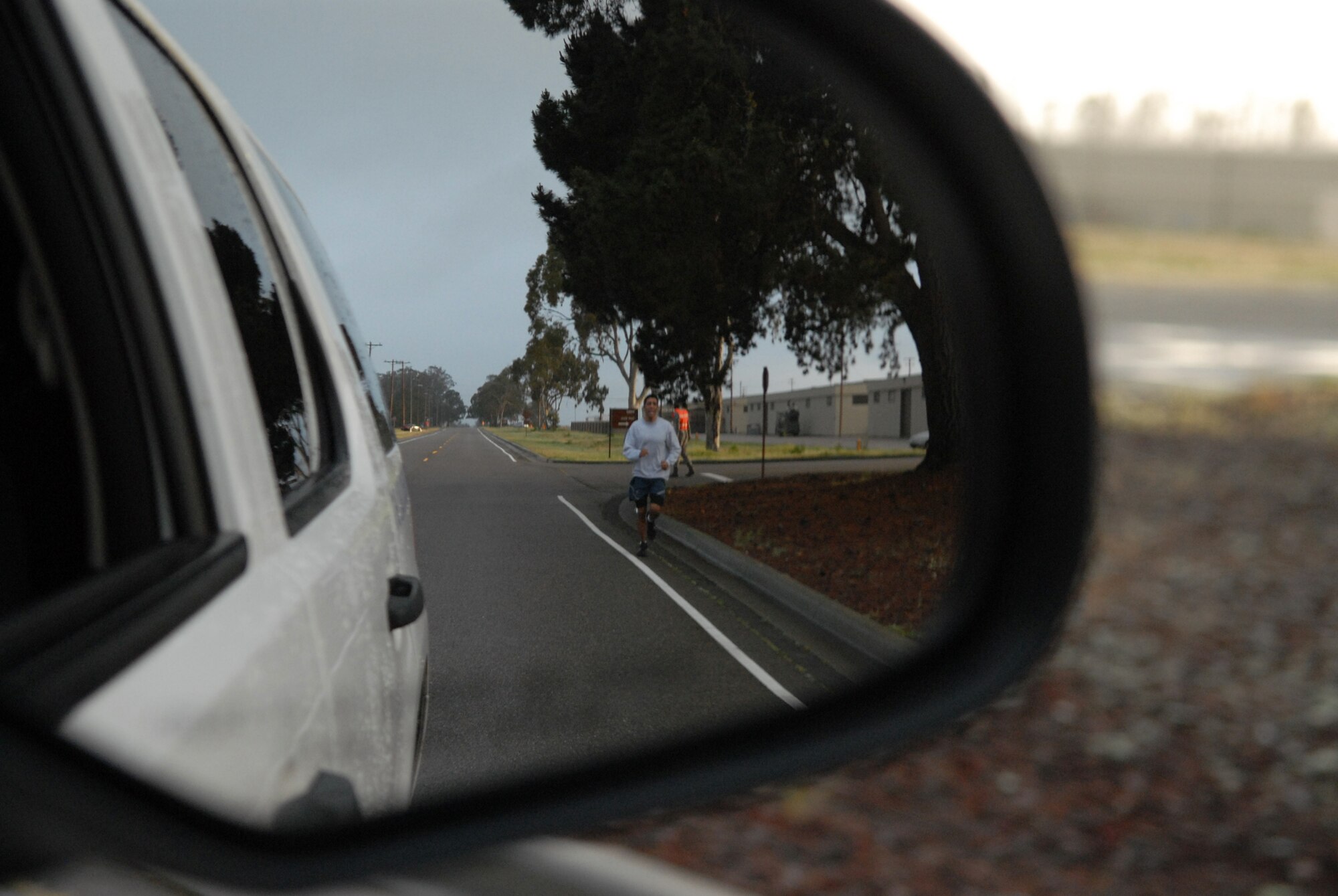 VANDENBERG AIR FORCE BASE, Calif. -- Following close behind the lead security forces vehicle, Staff Sgt. Anthony Cardenas, of the 381st Training Squadron, starts the last of four sections of paved roads that combine to make the three-mile April Awareness Month Kick-off Run here Tuesday, March 30, 2010. The participants were authorized to wear blue T-shirts in support of Child Abuse Prevention Month or teal T-shirts in support of Sexual Assault Awareness Month. (U.S. Air Force photo/Airman 1st Class Angelina Drake)