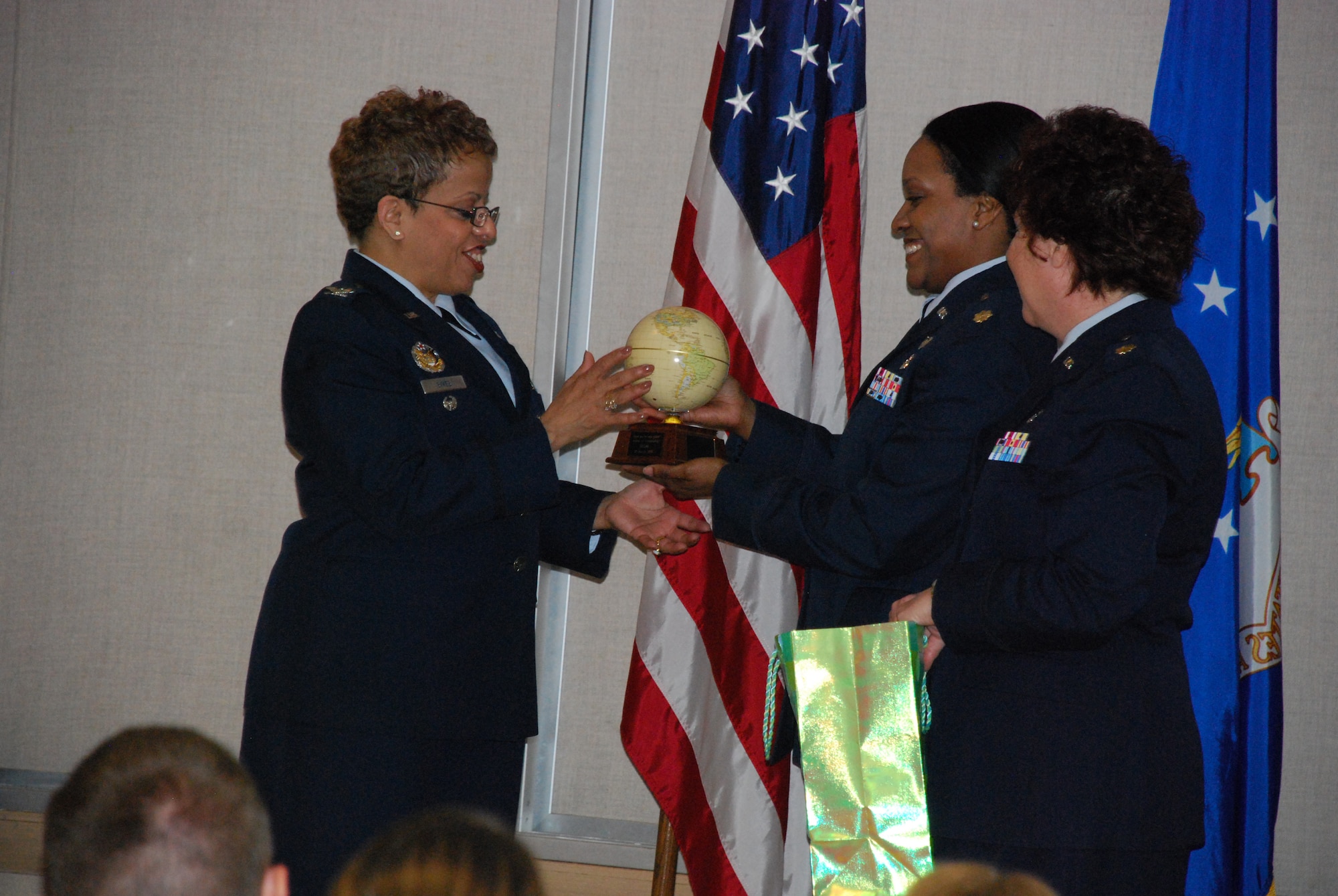 Col. Donnalee Sykes (left), chief of the Education and Training Division and director of the Air Force Nursing Services at Headquarters Air Force, Office of the Surgeon General, accepts a gift of appreciation from Maj. Michele Shelton and Maj. Paula Winters, 383rd Training Squadron Nursing Service Management course supervisors, during the 882nd Training Group NSM graduation at the Bldg. 1900 small auditorium March 30.  Colonel Sykes was the first officer of such high position to officiate an NSM graduation at Sheppard Air Force Base, Texas. (U.S. Air Force photo/Airman 1st Class Valerie Hosea)