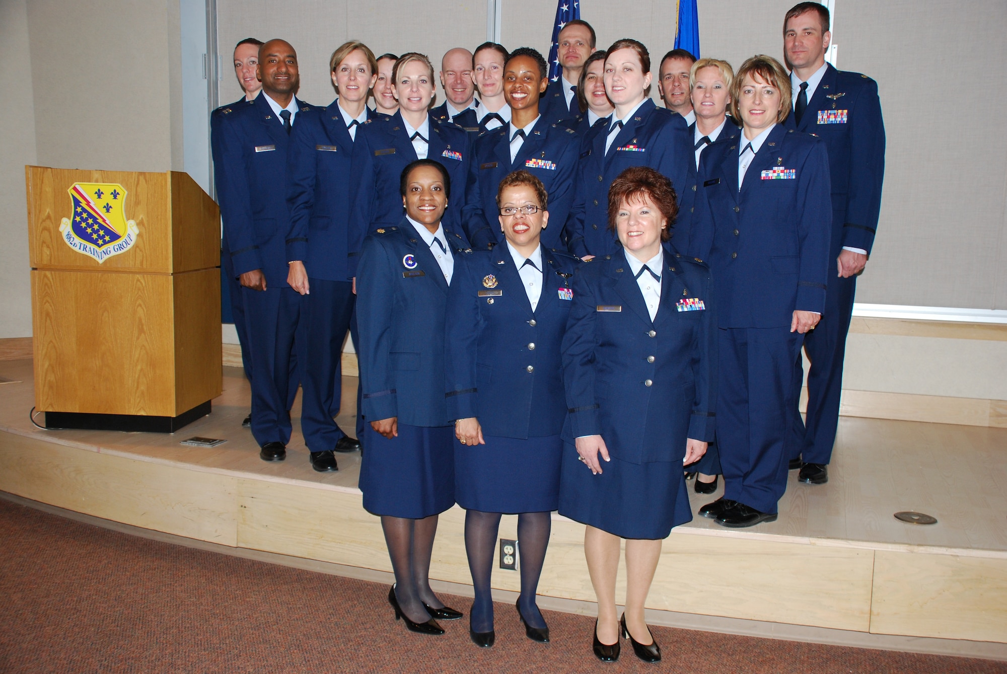 Col. Donnalee Sykes (front center), chief of the Education and Training Division and director of the Air Force Nursing Services at Headquarters Air Force, Office of the Surgeon General, poses with the Nursing Service Management graduating class and course supervisors at the Bldg. 1900 small auditorium March 30. Colonel Sykes was the first officer of such high position to officiate an 882 Training Group NSM graduation at Sheppard Air Force Base, Texas. (U.S. Air Force photo/Airman 1st Class Valerie Hosea)