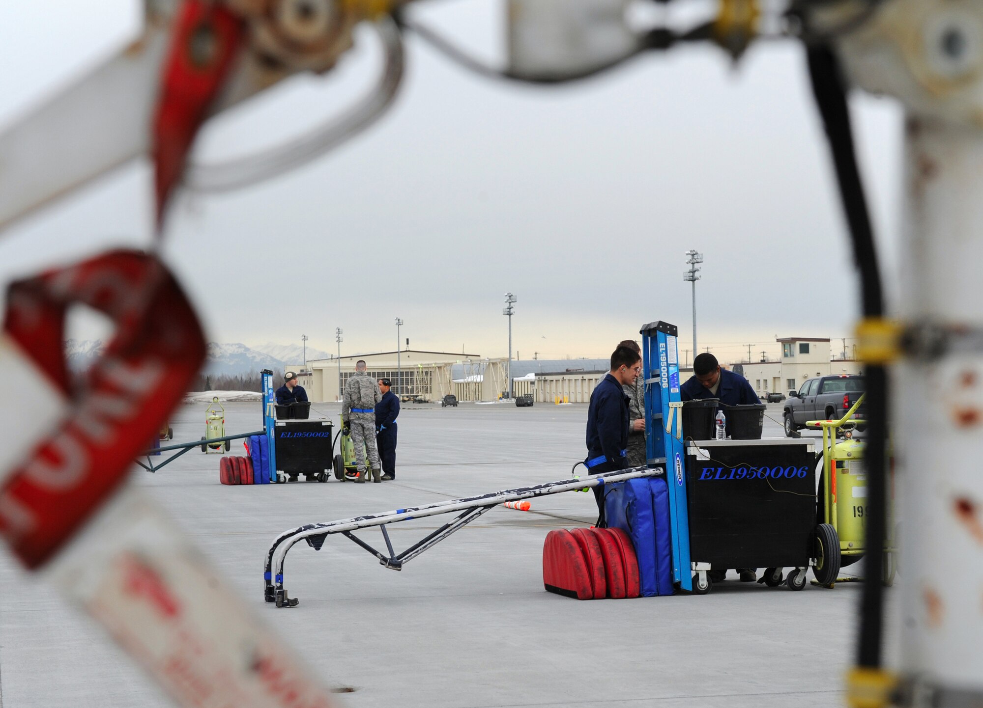 ELMENDORF AIR FORCE BASE, Alaska – Maintainers from the 19th Fighter Squadron await the return of their pilots and jets from their temporary duty assignment March 29. The 19th FS returned from their last TDY as a squadron here at Elmendorf.  (Air Force photo by Senior Airman Cynthia Spalding)