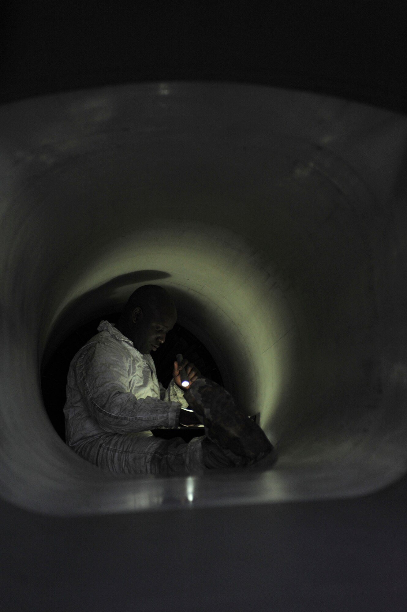ELMENDORF AIR FORCE BASE, Alaska – Staff Sgt. Emilo Gordon, 3rd Aircraft Maintenance Squadron, inspects fan blade damage inside one of the recently returned F-15 Eagles March 29. Elmendorf’s 19th Fighter Squadron is soon to be decommissioned with the first F-15s leaving in April 2010 and the final few are scheduled to leave in September 2010. Some of the jets returned from more than a month-long temporary duty assignment. Four jets from the 19th Fighter Squadron participated in Thailand’s exercise Cope Tiger from Feb. 26-March 13. After departing Thailand, they flew to Kadena Air Base where they rested for two days and flew out March 15 to meet up with four other Elmendorf F-15s, that participated in Cope Thaw at Hawaii. (Air Force photo by Airman 1st Class Christopher Gross)