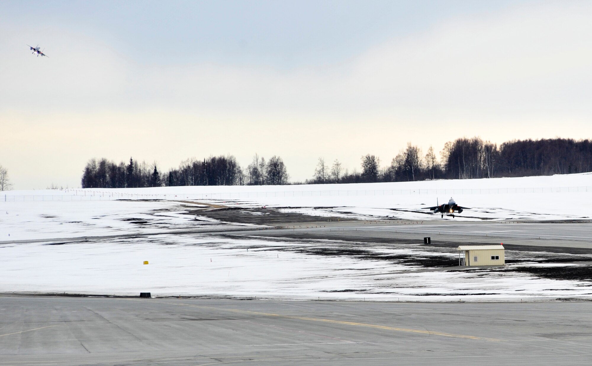 ELMENDORF AIR FORCE BASE, Alaska – Elmendorf F-15 Eagles land March 29, while arriving back from their deployed assignment. Elmendorf’s 19th Fighter Squadron is soon to be decommissioned with the first F-15s leaving in April 2010 and the final few scheduled to leave in September 2010. Some of the jets returned from more than a month-long temporary duty assignment. Four jets from the 19th Fighter Squadron participated in Thailand’s exercise Cope Tiger from Feb. 26-March 13. After departing Thailand, they flew to Kadena Air Base where they rested for two days and flew out March 15 to meet up with four other Elmendorf F-15s, that participated in Cope Thaw in Hawaii. (Air Force photo by Airman 1st Class Christopher Gross)