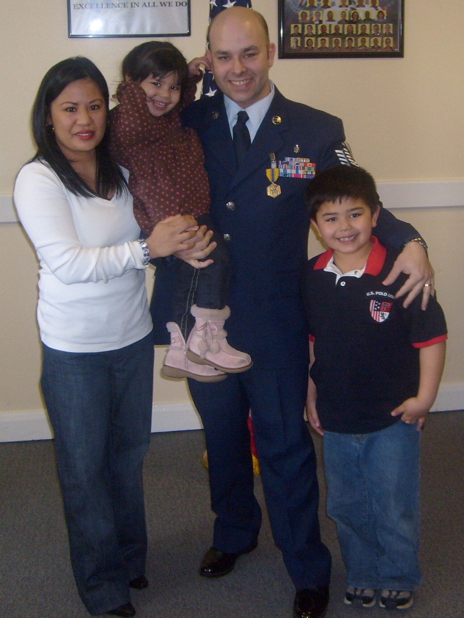 In happier times, Tech. Sgt. Shawn Mette, shares a smile with his wife, Nelia, and children, Sebastian, 9 and Skylar, 5. (Courtesy photo)