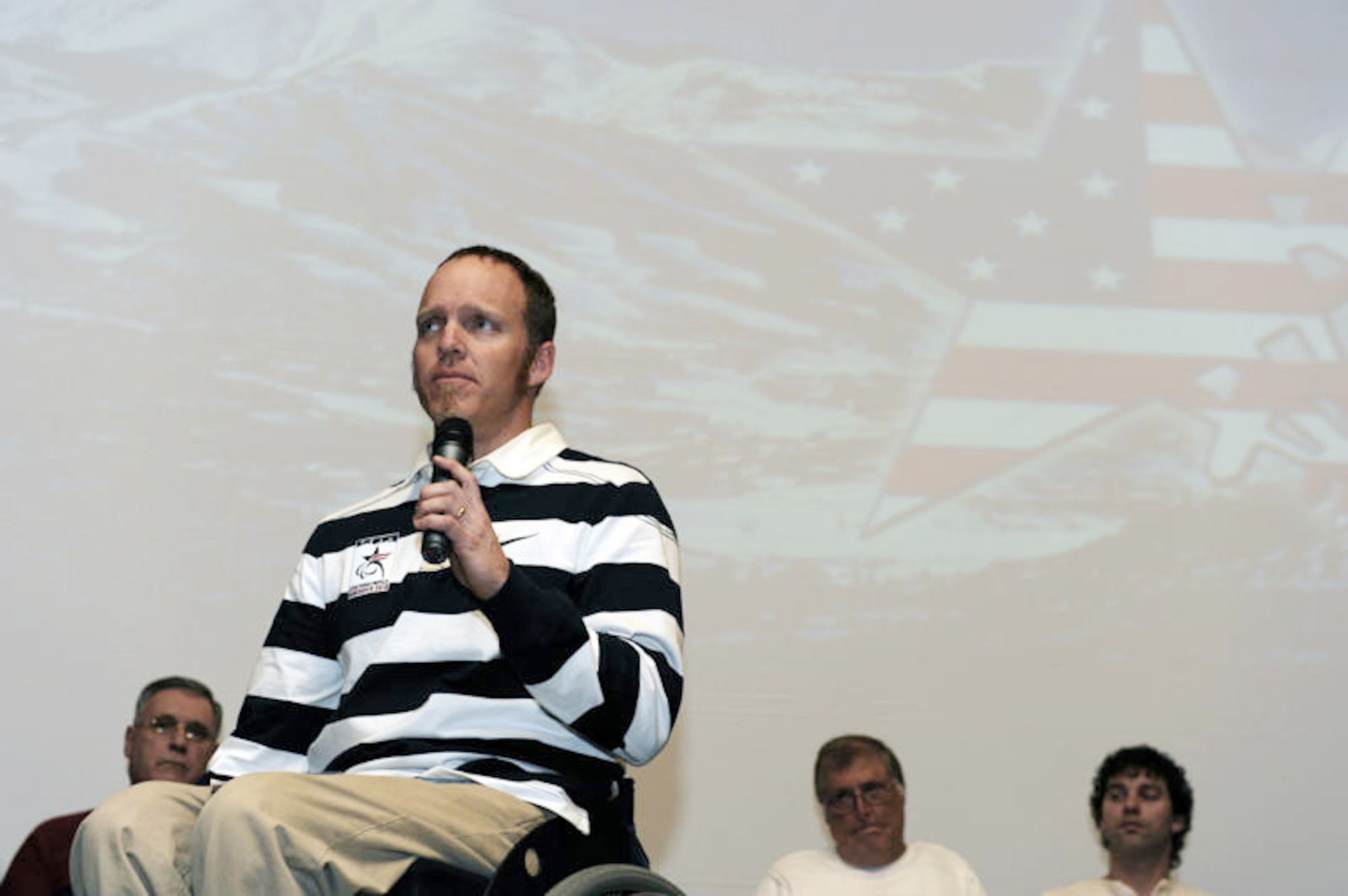 Air Force veteran Sean Halsted, who competed in the 2010 Paralympics in Vancouver, Canada, encourages his fellow disabled veterans during opening ceremonies of the 24th National Disabled American Veterans Winter Sports Clinic March 28, 2010, in Snowmass Village, Colo. (U.S. Air Force photo/Staff Sgt. Desiree N. Palacios)