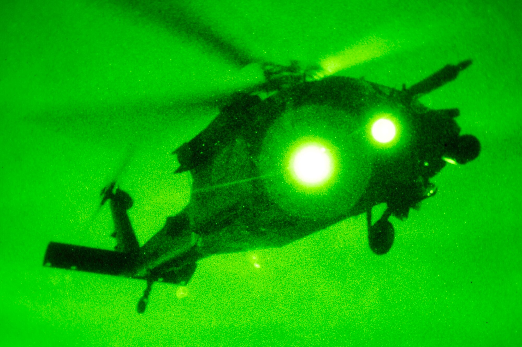 A 33rd Rescue Squadron HH-60 Pave Hawk takes off with three rescued aircrew from the 909th Air Refueling Squadron after a simulated KC-135 Stratotanker crash March 25, 2010, at Kadena Air Base, Japan. Members of the 909th ARS spent the afternoon training proper survival and evasion procedures. The 18th Wing participated in a local operational readiness exercise to test base Airmen's ability to defend Japan and maintain peace and stability in the Pacific region. (U.S. Air Force photo/Senior Airman Amanda N. Grabiec)