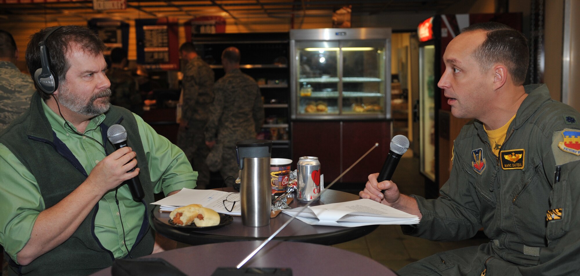 SHAW AIR FORCE BASE, S.C. -- Derek Burress, host of the "Good Morning Sumter!" radio show, interviews Lt. Col. Marc Dauteuil, 79th Fighter Squadron director of operations, in the atrium of the support center, March 19. The Sumter Radio Station broadcasted Cadet News and entertainment from 1942 to 1944. Today, listeners may tune to WDXY 1240 AM or 105.9 FM from 7 a.m. to 9 a.m. the first and third Friday each month for Touching Base.  This program showcases Shaw's mission, and the Airmen who accomplish it. (U.S. Air Force photo/Tech. Sgt. Josef Cole)
