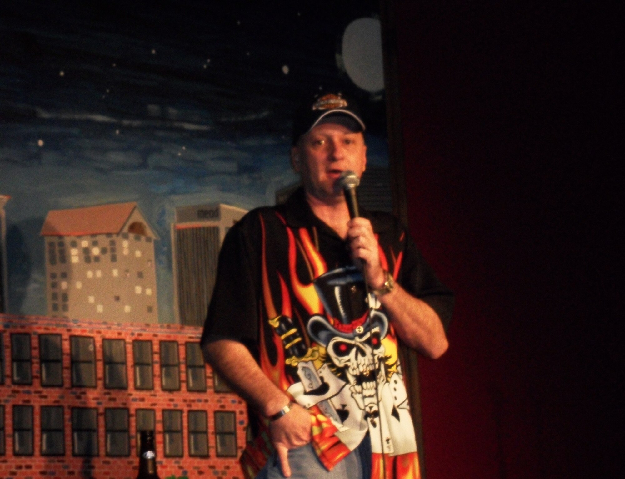 WRIGHT-PATTERSON AIR FORCE BASE, Ohio – Tech. Sgt. Tracy Cooper, 89th Airlift Squadron, performs before a crowd at Wiley’s Comedy Club in Dayton, Ohio. Known as the “Biker Comic”, the flight engineer has a new career in stand-up comedy that has exploded over the past few months.(Courtesy photo)