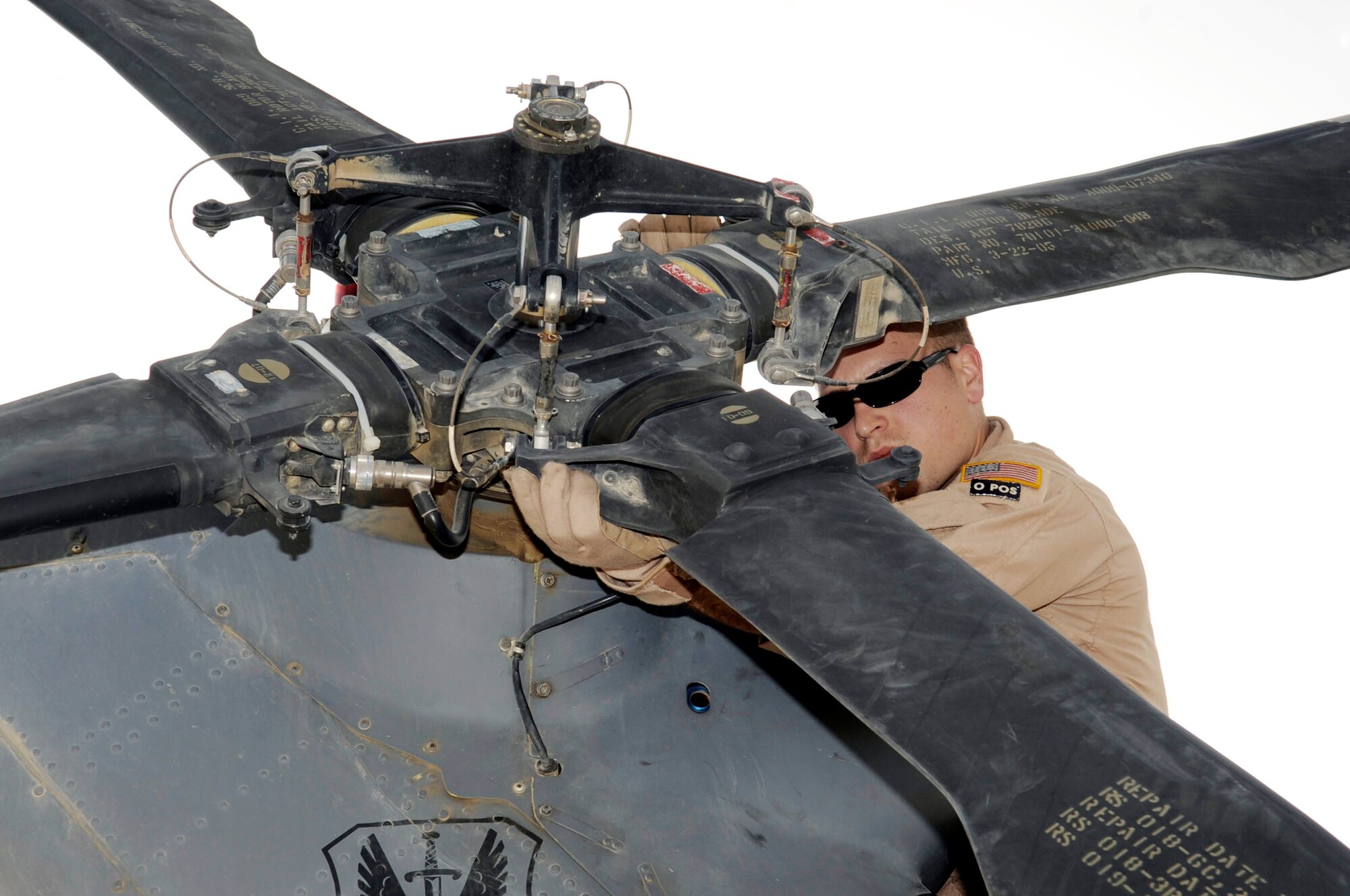 Tech. Sgt. William Nabakowski conducts a routine preflight check on a HH-60G Pave Hawk helicopter March 5, 2010, at Kandahar Airfield, Afghanistan. Sergeant Nabakowski is a 66th Expeditionary Rescue Squadron aerial gunner from Nellis Air Force Base, Nev. (U.S. Air Force photo/Senior Airman Nancy Hooks)