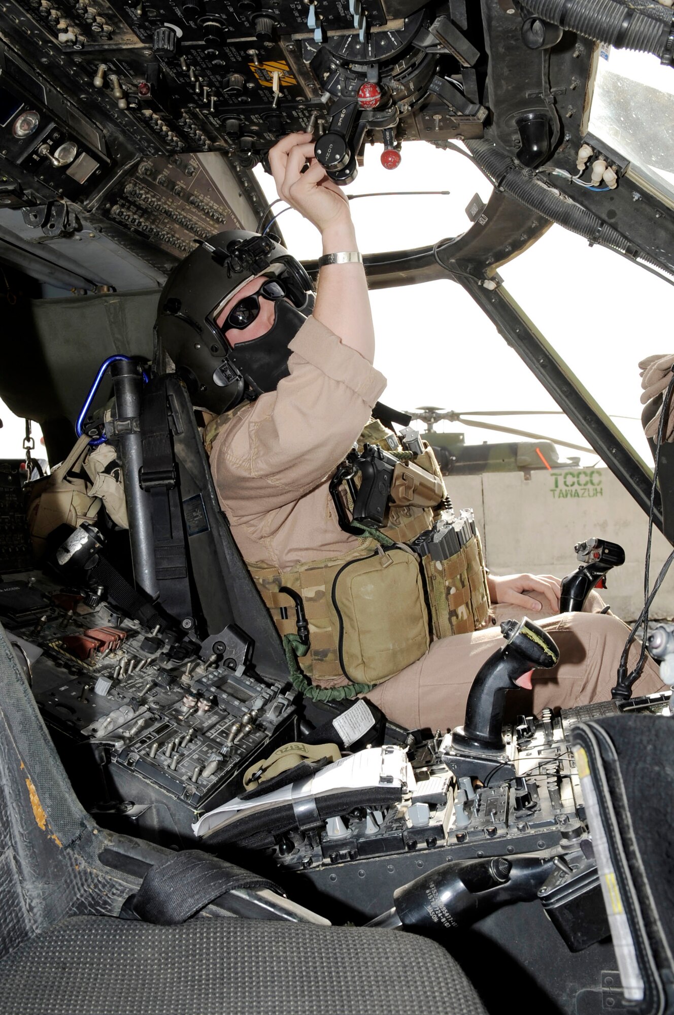Capt. Rob Roth conducts preflight checks inside of a HH-60G Pave Hawk helicopter March 5, 2010, at Kandahar Airfield, Afghanistan. Captain Roth is a 66th Expeditionary Rescue Squadron mission pilot from Nellis Air Force Base, Nev. (U.S. Air Force photo/Senior Airman Nancy Hooks)