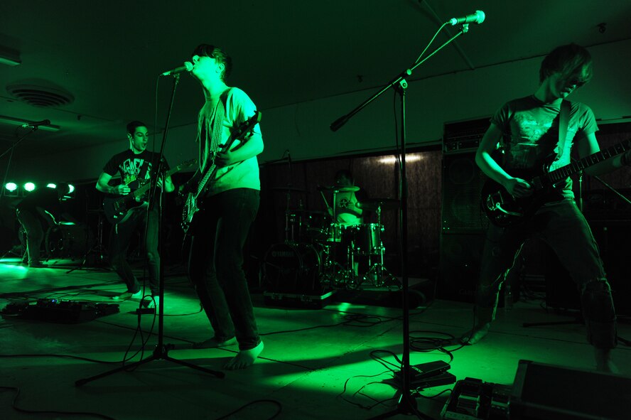 MINOT AIR FORCE BASE, N.D. -- I, Apparatus play a song at Minot Air Force Base during the Battle of the Bands competition held at the old base shopette March 26. Six bands showcased their talent and let the audience decide the winner. The first-ever event was sponsored by the 5th Force Support Squadron. (U.S. Air Force photo by Staff Sgt. Stacy Moless)