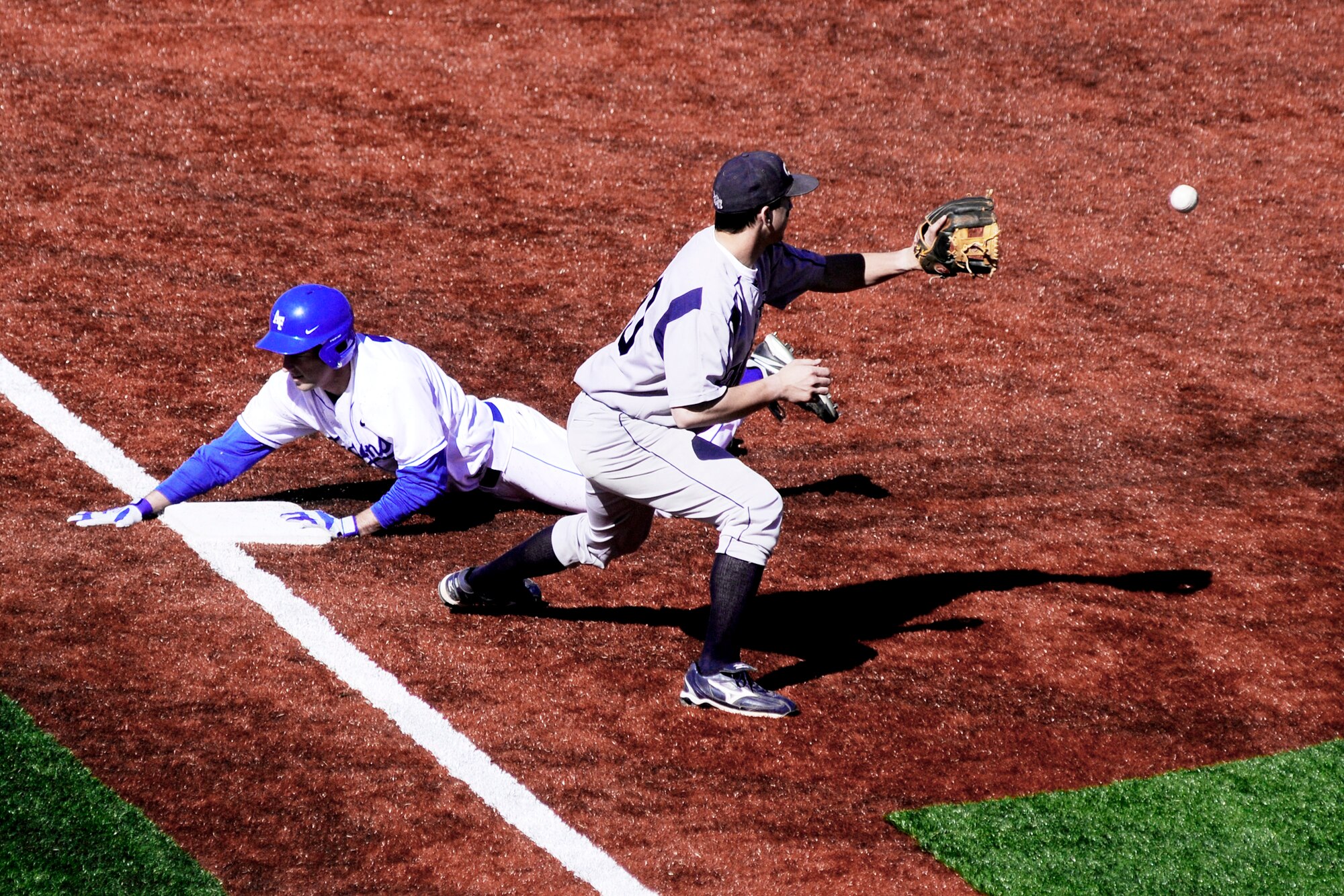 Falcon senior Addison Gentry slides successfully into third base during play against Colorado School of Mines March 16, 2010, at the U.S. Air Force Academy's Falcon Field in Colorado.  Gentry went 2-to-4 on the day with three RBIs in the 12-10 victory (U.S. Air Force photo/Johnny Wilson)