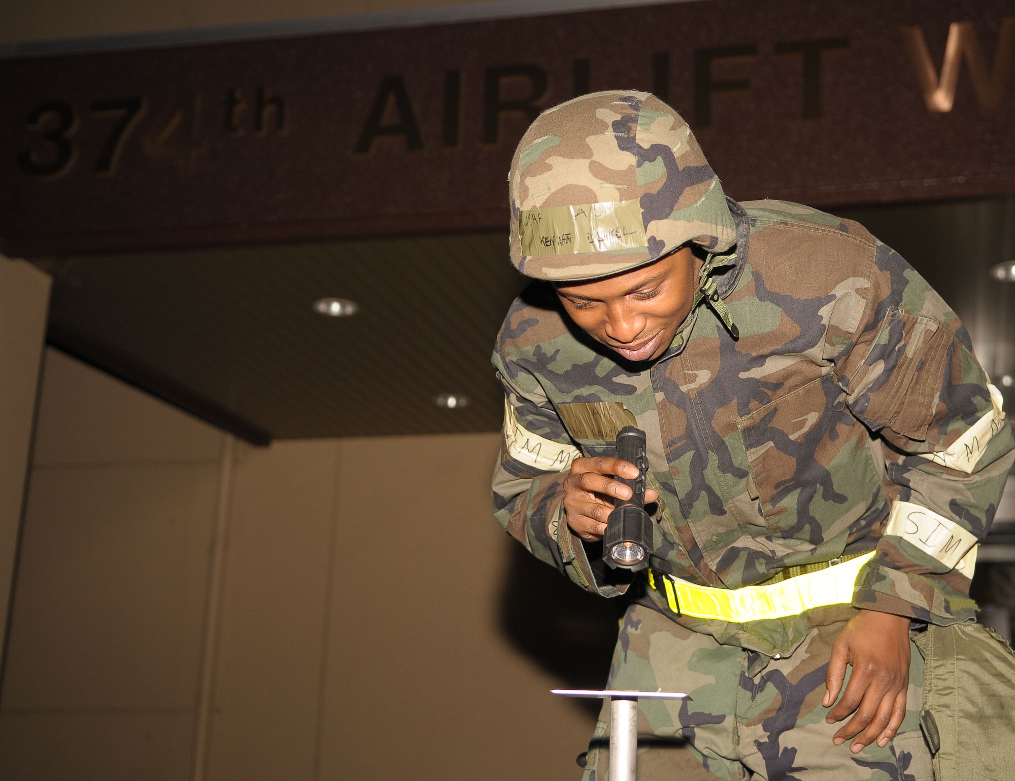 YOKOTA AIR BASE, Japan -- Airman 1st Class Kenneth Leavell, 374th Airlift Wing, checks an M-8 stand for contamination during an operational readiness exercise Mar. 31. The exercise tested Yokota Airmen's operational readiness preparedness. (U.S. Air Force photo/Airman 1st Class Sean Martin)