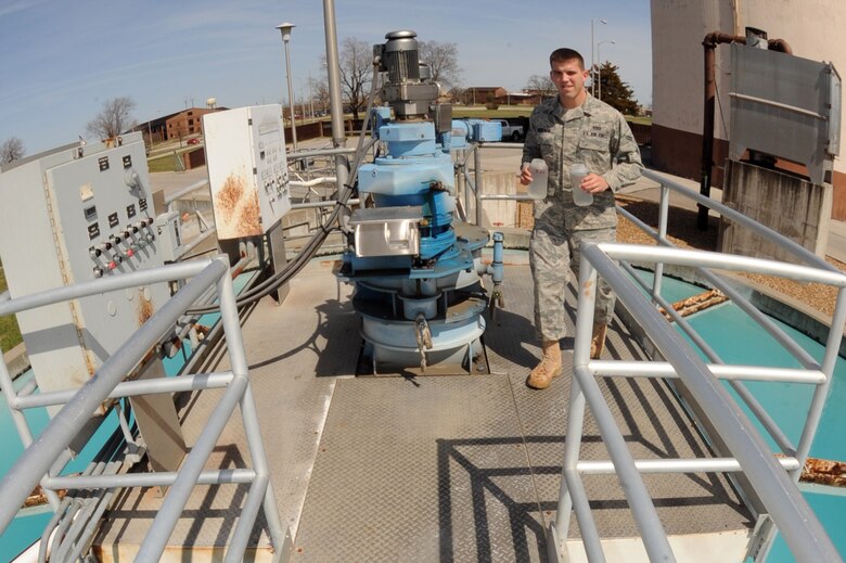 WHITEMAN AIR FORCE BASE, Mo. - Airman 1st Class Jayson Eddelman, 509th Civil Engineer Squadron water treatment plant operator, brings back water samples from around the plant to the water testing lab for the 12 p.m. testing, March 29, 2010. The water treatment plant here goes beyond what Missouri Department of Natural Resources requires by conducting more than 340 tests each day, ensuring the highest quality water for Team Whiteman. (U.S. Air Force photo/ Airman 1st Class Carlin Leslie)  (Released)
