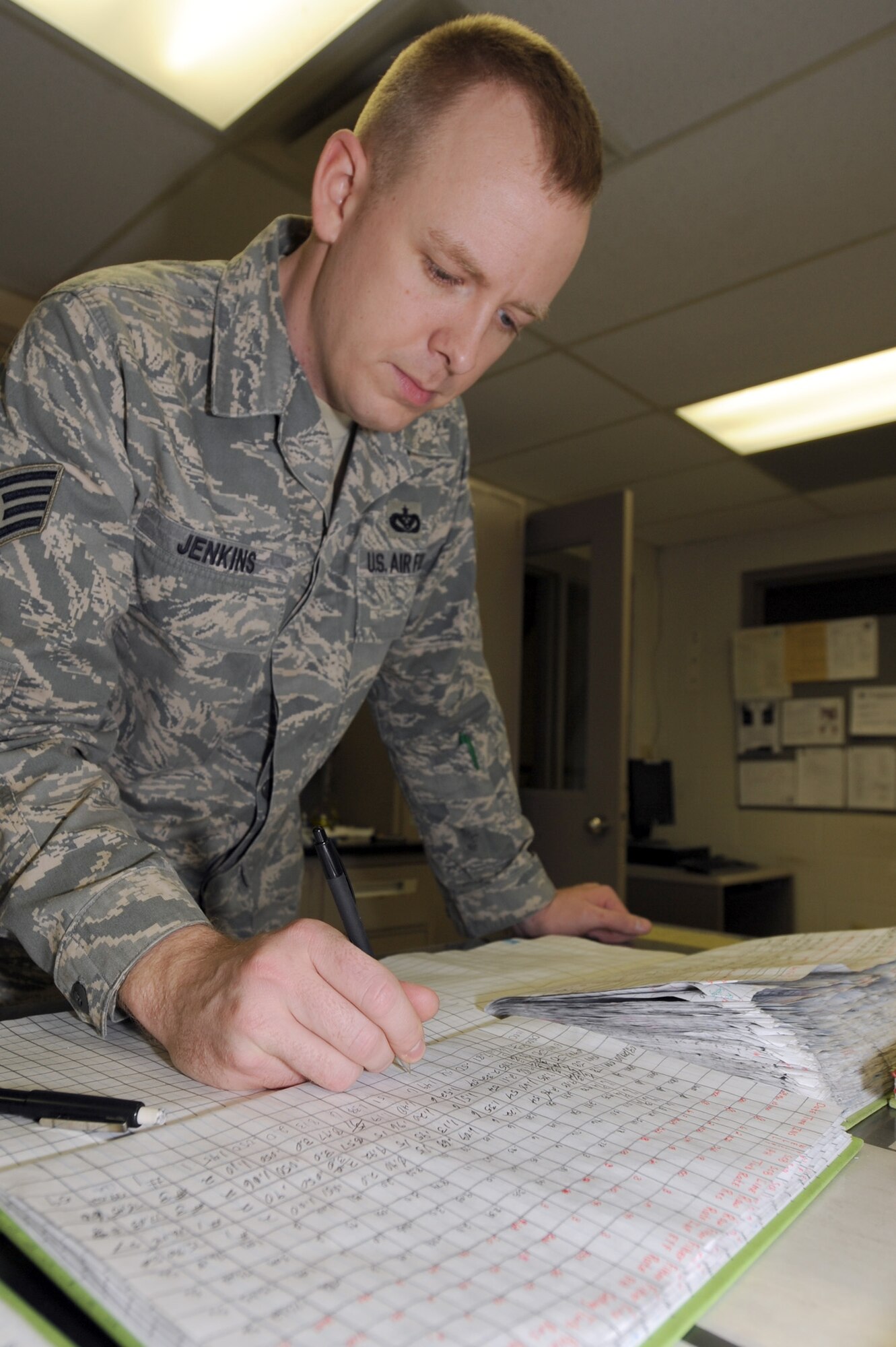 WHITEMAN AIR FORCE BASE, Mo. - Staff Sgt. Jason Jenkins, 509th Civil Engineer Squadron, water treatment plant operator, documents his findings from the 10 a.m. water tests, 29 March, 2010.The water treatment plant here goes beyond what Missouri Department of Natural Resources requires, ensuring the highest quality water for Team Whiteman. (U.S. Air Force photo/ Airman 1st Class Carlin Leslie)  (Released)
