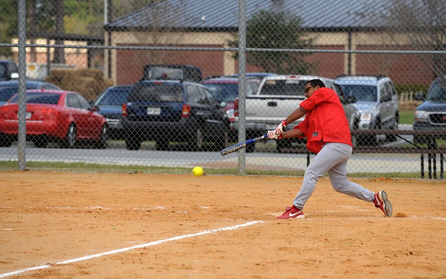 MOODY AIR FORCE BASE, Ga. -- Staff Sgt. Jose Santana-Ortiz, 23rd Medical Group bio-environmental technician, hits a hard ball to the outfield during the "Battle of the Base" softball tournament here March 27. The 23rd MDG had a fast start, but couldn’t hold off the momentum from the 23rd Equipment Maintenance Squadron munitions flight losing in the second round. “The 23rd MDG was our biggest competition,” said Tech. Sgt. Jessie Synder, 23rd EMS munitions flight team softball coach. “We played them three times that night because they kept winning their games.” (U.S. Air Force photo Airman 1st Class Joshua Green)