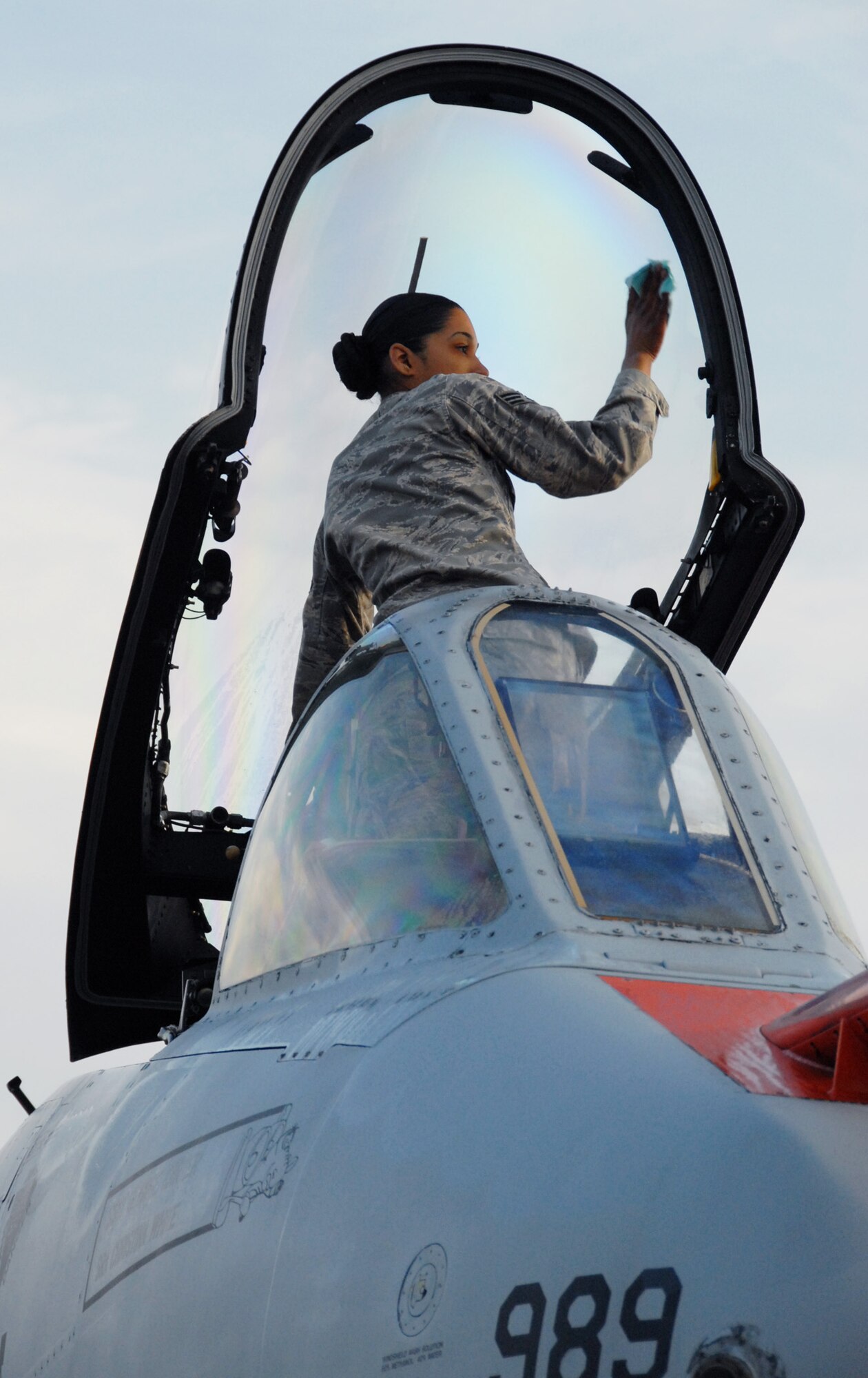 Senior Airman Christina White, 46th Aircraft Maintenance Squadron, cleans the canopy of an A-10C Thunderbolt II prior to take-off March 25 at Eglin Air Force Base, Fla. Aircraft maintainers in the 46th Test Wing work on F-16s, F-15s, A-10s, C-130s and even UH-1s.  They maintain both the 46th TW aircraft, but also the 53rd Wing's aircraft. (U.S. Air Force photo/Samuel King Jr.)