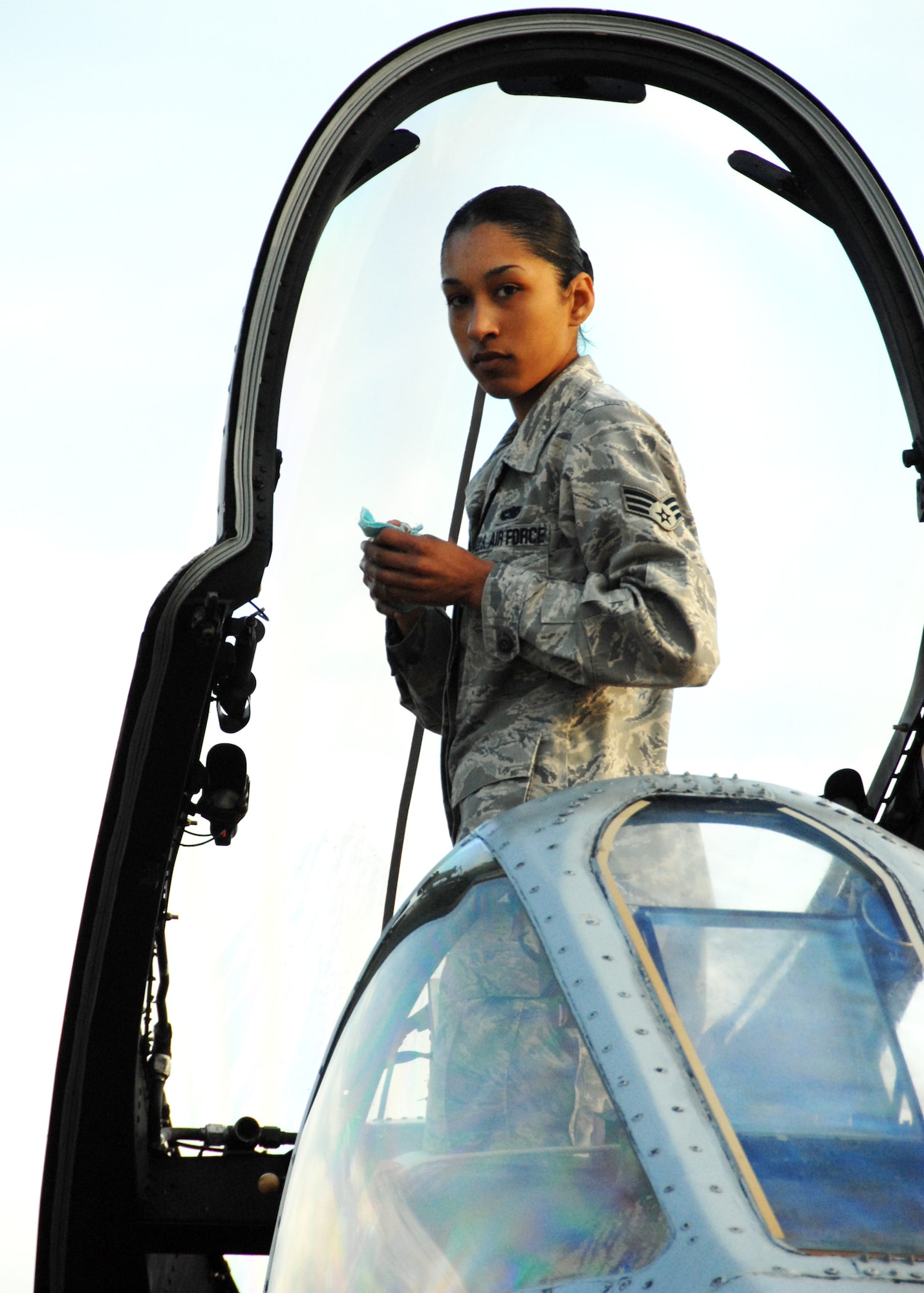 Senior Airman Christina White, 46th Aircraft Maintenance Squadron, takes a break from cleaning the canopy of an A-10C Thunderbolt II prior to take-off March 25 at Eglin Air Force Base, Fla. Aircraft maintainers in the 46th Test Wing work on F-16s, F-15s, A-10s, C-130s and even UH-1s.  They maintain both the 46th TW aircraft, but also the 53rd Wing's aircraft. (U.S. Air Force photo/Samuel King Jr.)