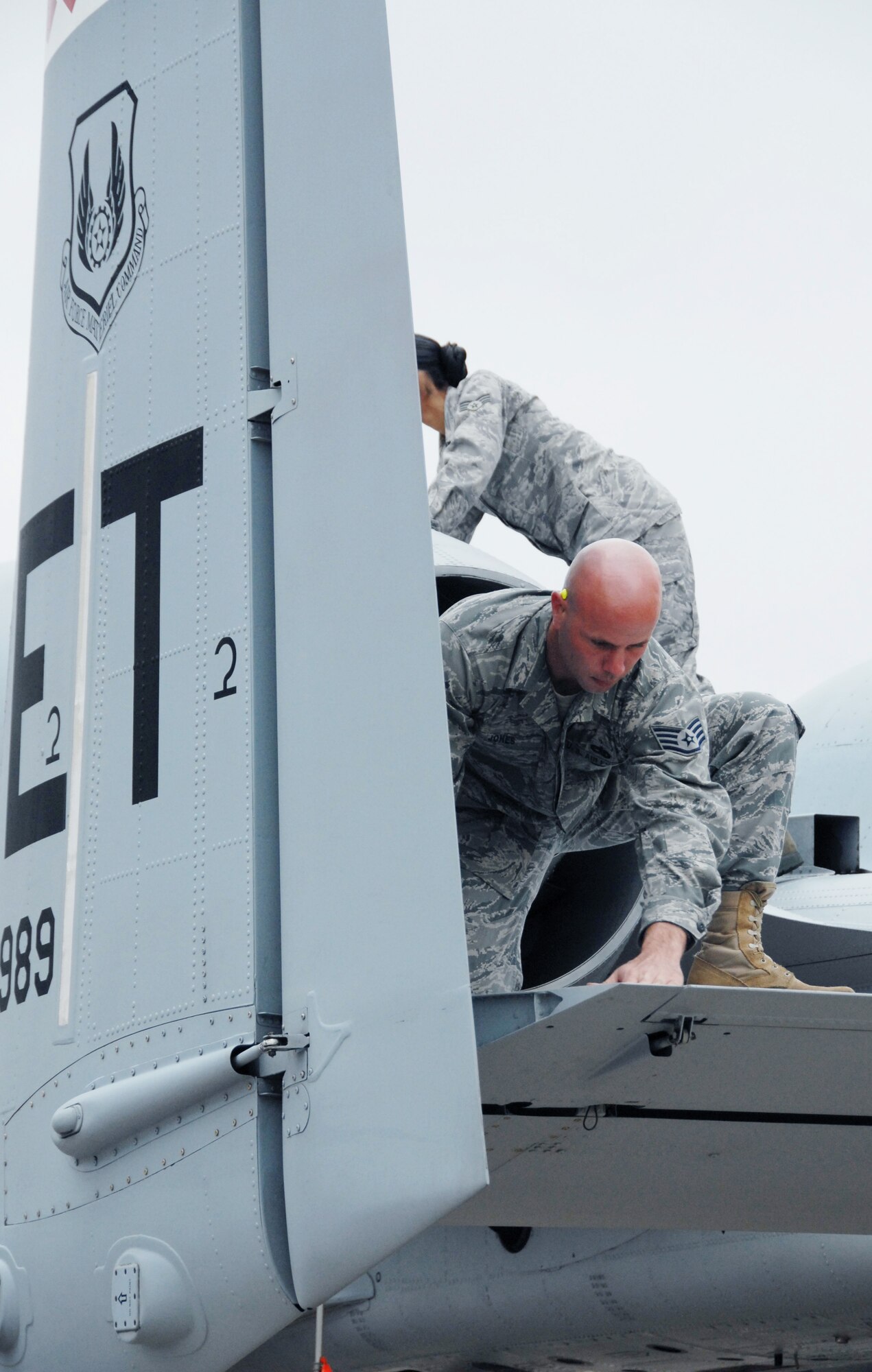 Staff Sgt. Rusty Jones and Senior Airman Christina White,  46th Aircraft Maintenance Squadron, perform post-flight checks on an A-10C Thunderbolt II March 25 at Eglin Air Force Base, Fla. Aircraft maintainers in the 46th Test Wing work on F-16s, F-15s, A-10s, C-130s and even UH-1s.  They maintain both the 46th TW aircraft, but also the 53rd Wing's aircraft. (U.S. Air Force photo/Samuel King Jr.)