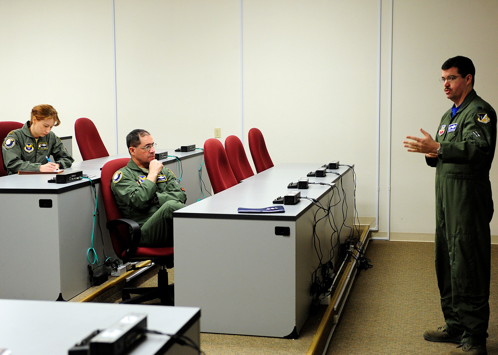 HOLOMAN AIR FORCE BASE, N.M. -- Lt. Gen. Marc Rogers, U.S. Air Force Inspector General, receives an MQ-1 Predator and MQ-9 Reaper briefing from Lt. Col Ryan Sherwood, 6th Reconnaissance Squadron commander, March 26, 2010, as a part of his tour of the base. General Rogers, a former 49th Fighter Wing commander, provides inspection policy and oversees the inspection and evaluation system for all Air Force nuclear and conventional forces, as well oversees counterintelligence operations. (U.S. Air Force photo by Senior Airman DeAndre Curtiss)(Released) 
