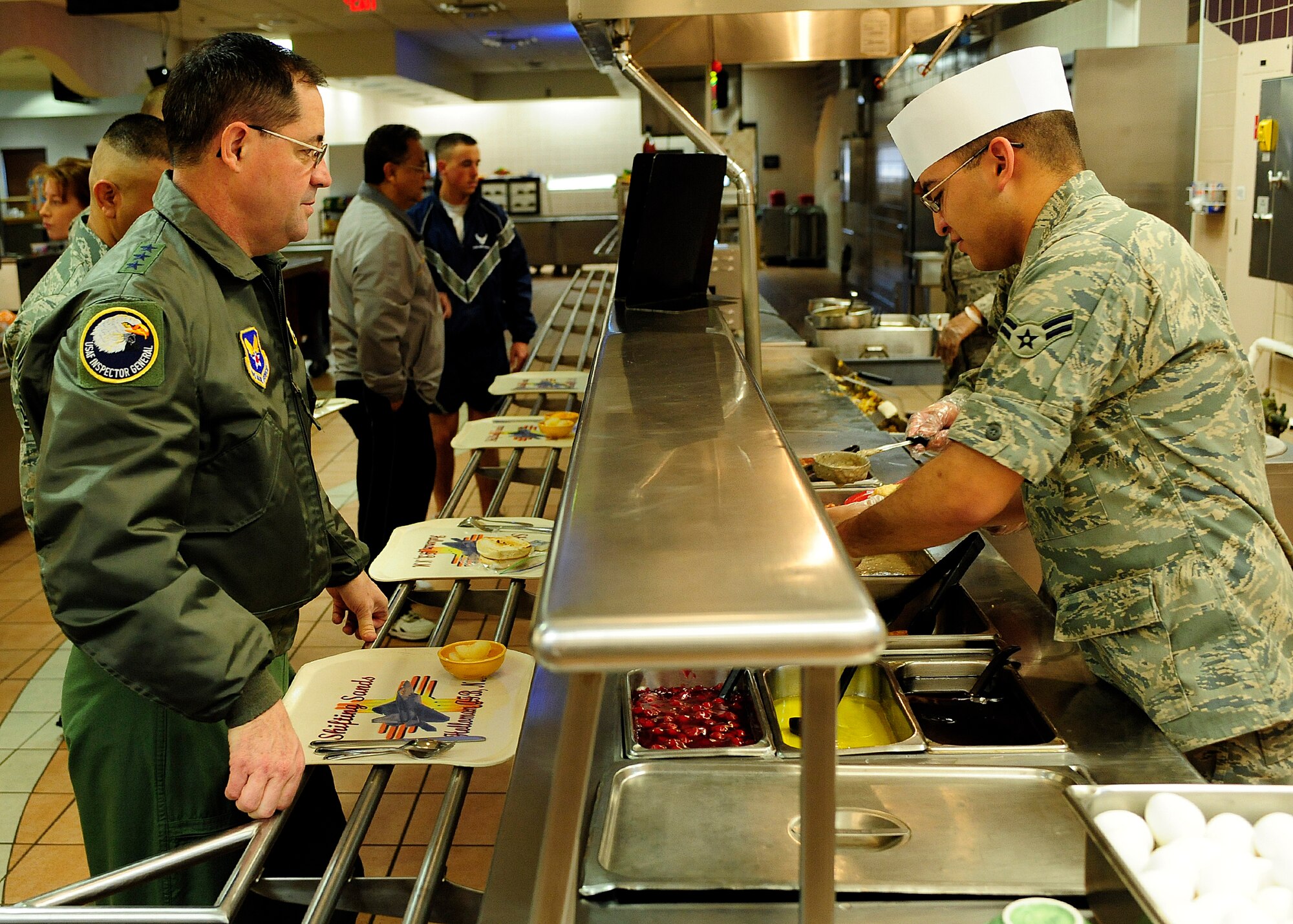 HOLOMAN AIR FORCE BASE, N.M. -- Lt. Gen. Marc Rogers, U.S. Air Force Inspector General, goes through the dining facility main food line with 49th Fighter Wing Command Chief Master Sgt. Gerardo Tapia, March 26, 2010, as a part of his tour of the base. General Rogers, a former 49th Fighter Wing commander, has commanded at the squadron, group, wing and numbered air force levels. He has led deployed combat operations in both Iraq and Bosnia. (U.S. Air Force photo by Senior Airman DeAndre Curtiss)(Released)