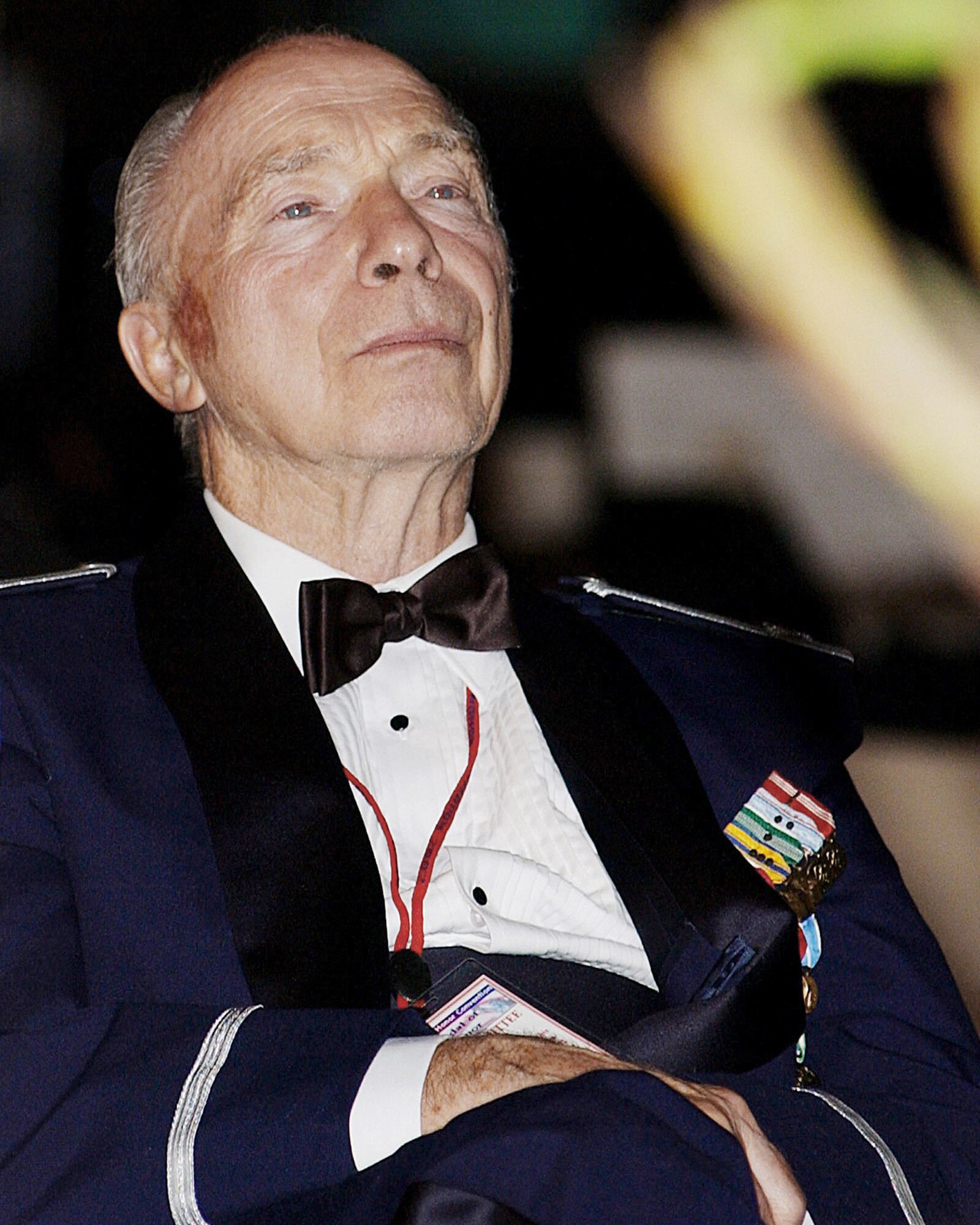 Retired Col. Steve dePyssler, the director of the Retiree Activities Office at Barksdale Air Force Base, La., listens to Gen. Norman H. Schwarzkopf speak Sept. 12, 2002, during the Congressional Medal of Honor Society's national convention banquet in Shreveport, La.  (U.S. Air Force photo/Master Sgt. Michael Kaplan)