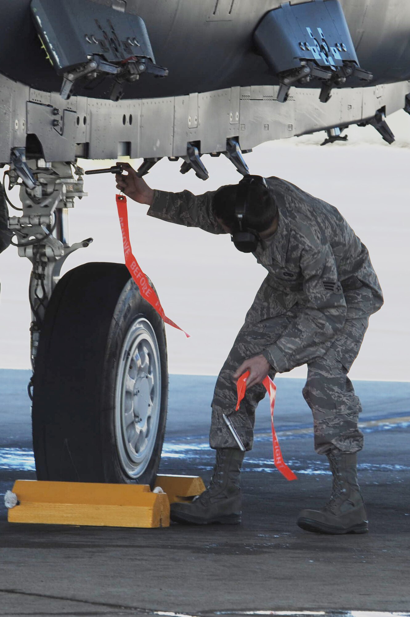 Senior Airman Bobby Kerr, a 307th Fighter Squadron crew chief at Seymour Johnson Air Force Base, N.C., inserts safety pins into an F-15E Strike Eagle after a flight March 19, 2010.  The 307th FS falls under the 414th Fighter Group, a new Air Force Reserve Command unit standing up on Seymour Johnson AFB to support the growing F-15E Strike Eagle mission. (U.S. Air Force photo/Senior Airman Whitney Lambert)